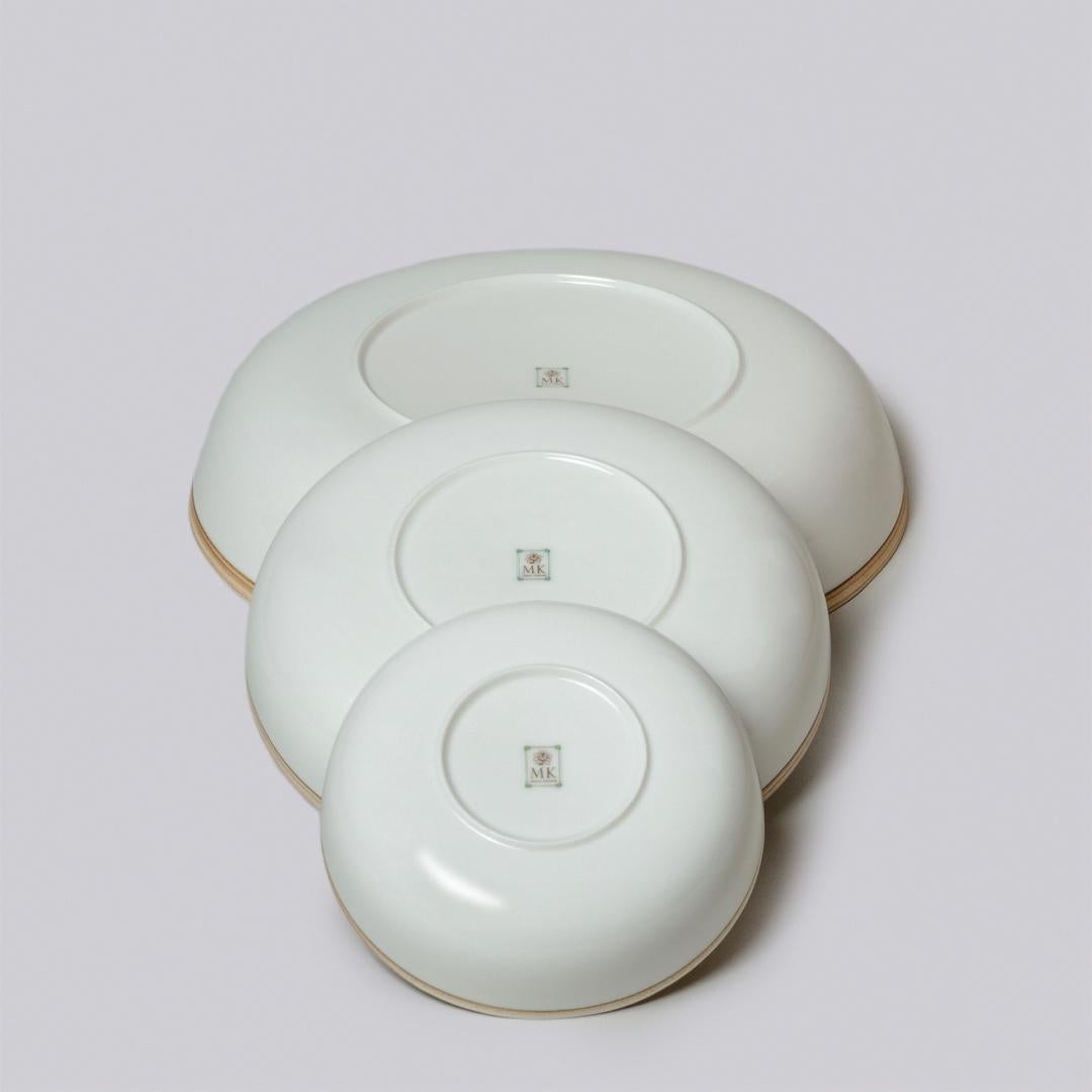 Molded Set of Four Ivory Glazed Porcelain Hermit Bowls with Rustic Rim