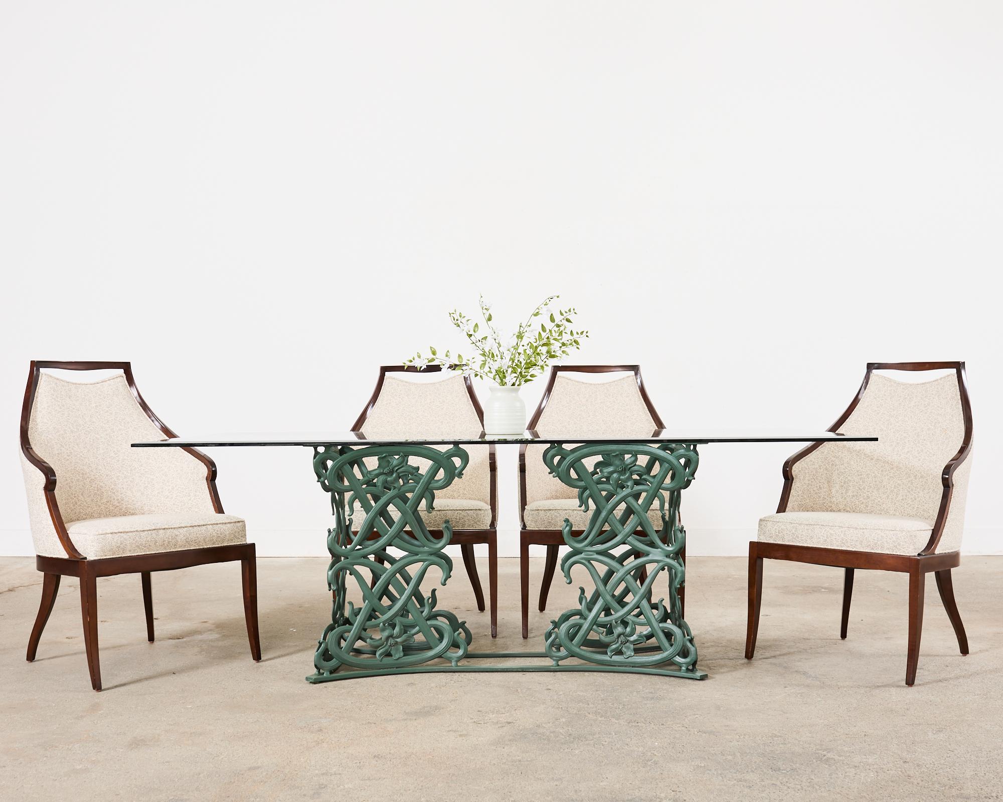 Graceful set of four hardwood dining chairs designed by Jacques Garcia for Baker. The Malmaison dining chairs (model #BA3743) feature a sinuous hardwood frame inspired by the Napoleonic style of Fountainebleau Palace. The chair frames have an open