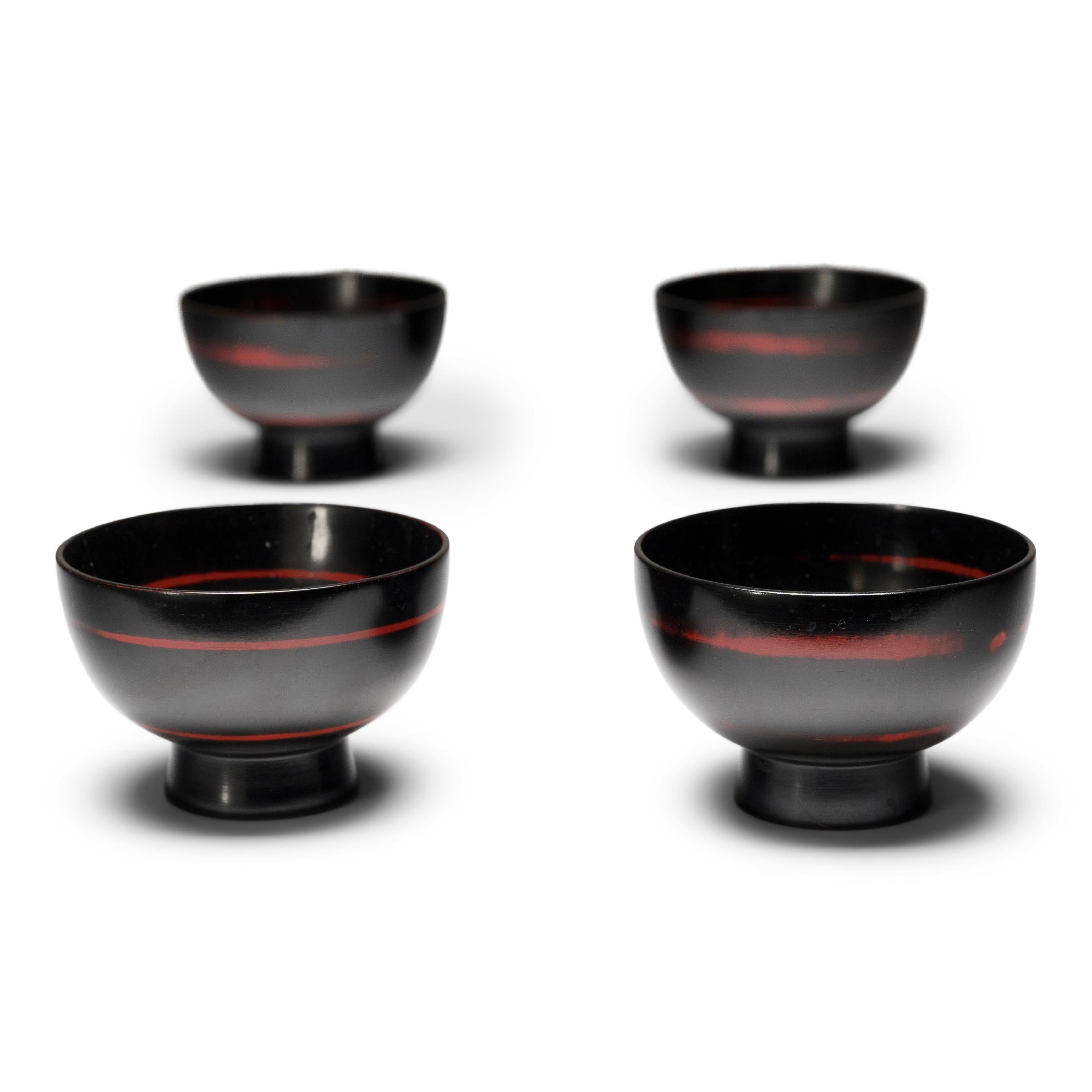 Set of Four Japanese Black Lacquer Bowls with Red Spiral 1