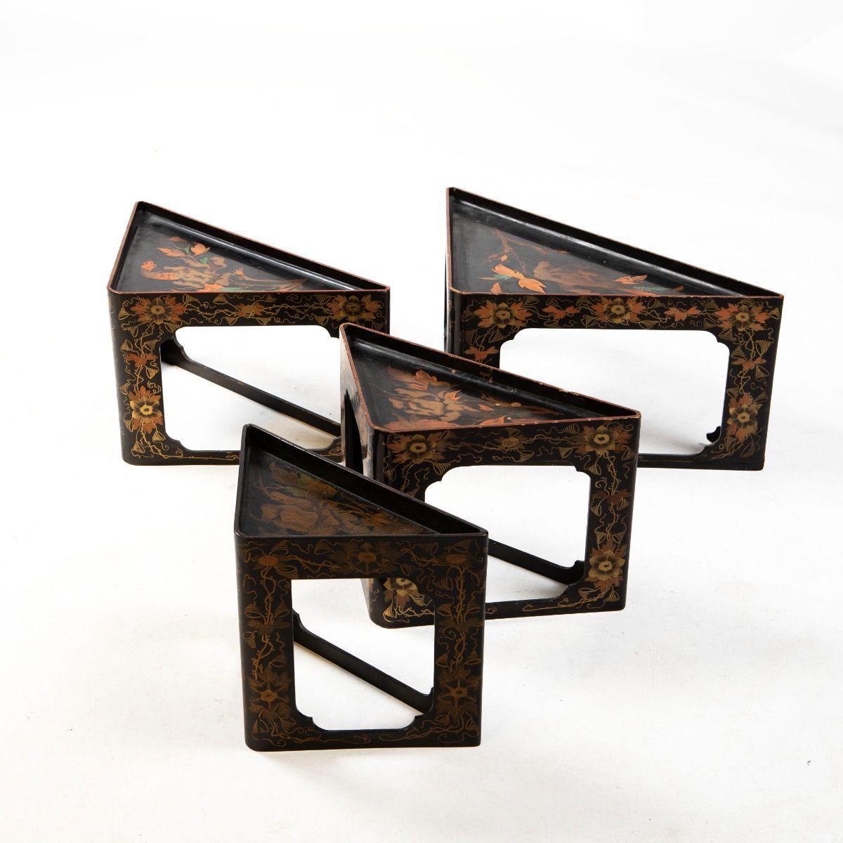 This rare set of four Japanese triangular nesting corner tables or console tables dates from the late Meiji period, circa 1900.
Each table is crafted in wood and finished with richly executed polychrome lacquer work, featuring finely painted