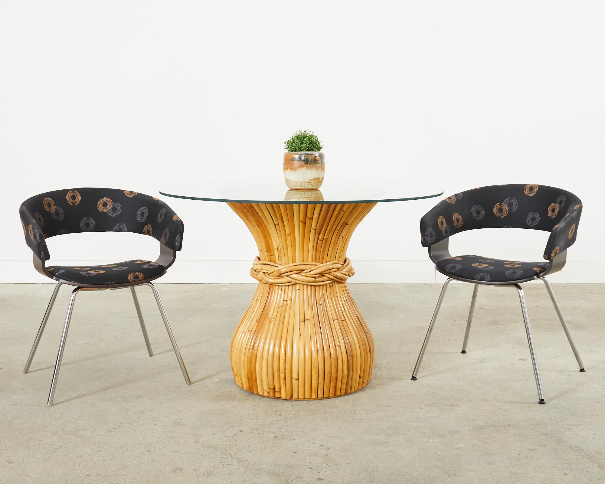 Stylish set of four post modern dining armchairs designed by John Coleman for Allermuir in the late 20th century. Known as the Mollie chair with a gracefully curved wood shell in an ebonized finish. The shell seat is supported by chromed steel legs.