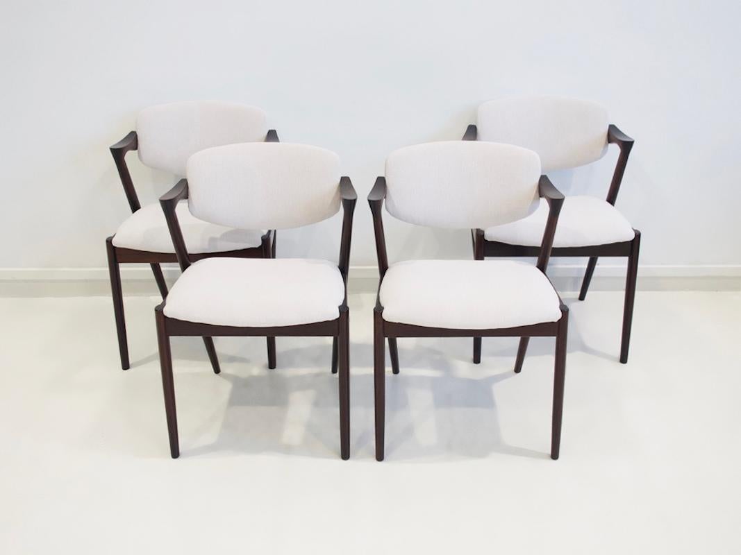 Scandinavian Modern Set of Four Kai Kristiansen Model 42 Chairs with White Upholstery