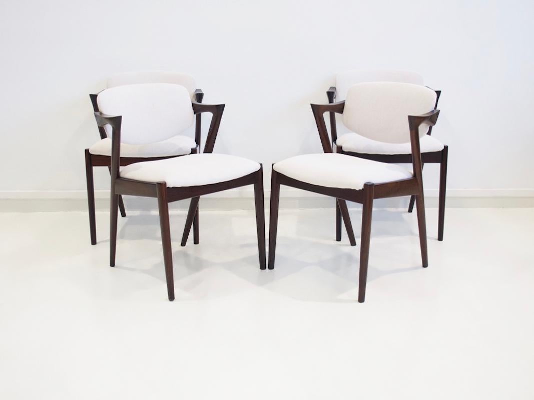 Danish Set of Four Kai Kristiansen Model 42 Chairs with White Upholstery