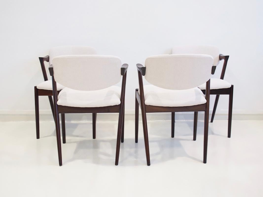Fabric Set of Four Kai Kristiansen Model 42 Chairs with White Upholstery