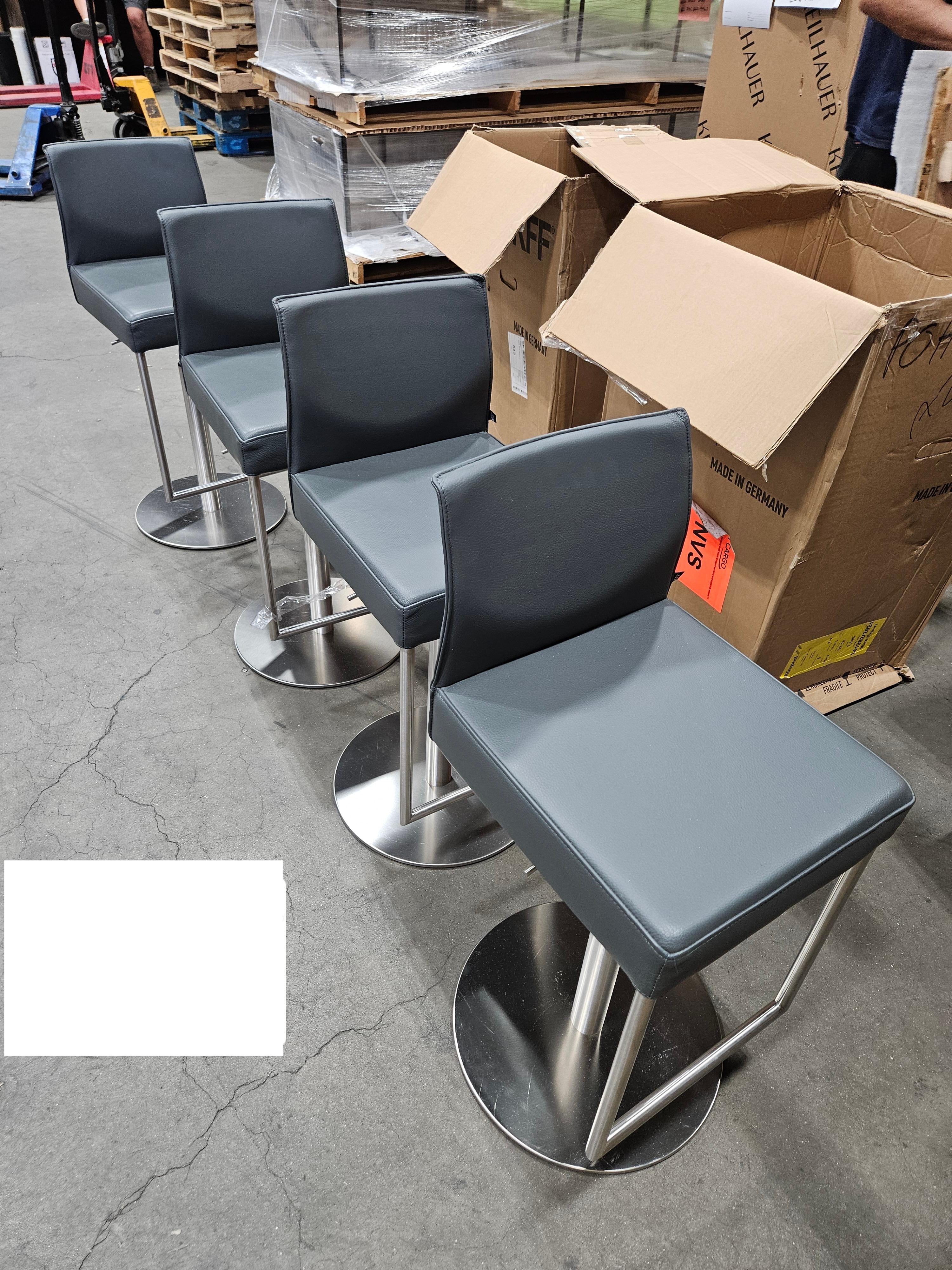 KFF Glooh Height-Adjustable Stool
Base Finish: Stainless Steel
Upholstery: Belo Leather, Color: elephant
SEATING HEIGHT: 62-82 CM 

An ergonomically shaped low back nestles against the straight seat. High seating with comfort and clear lines are the