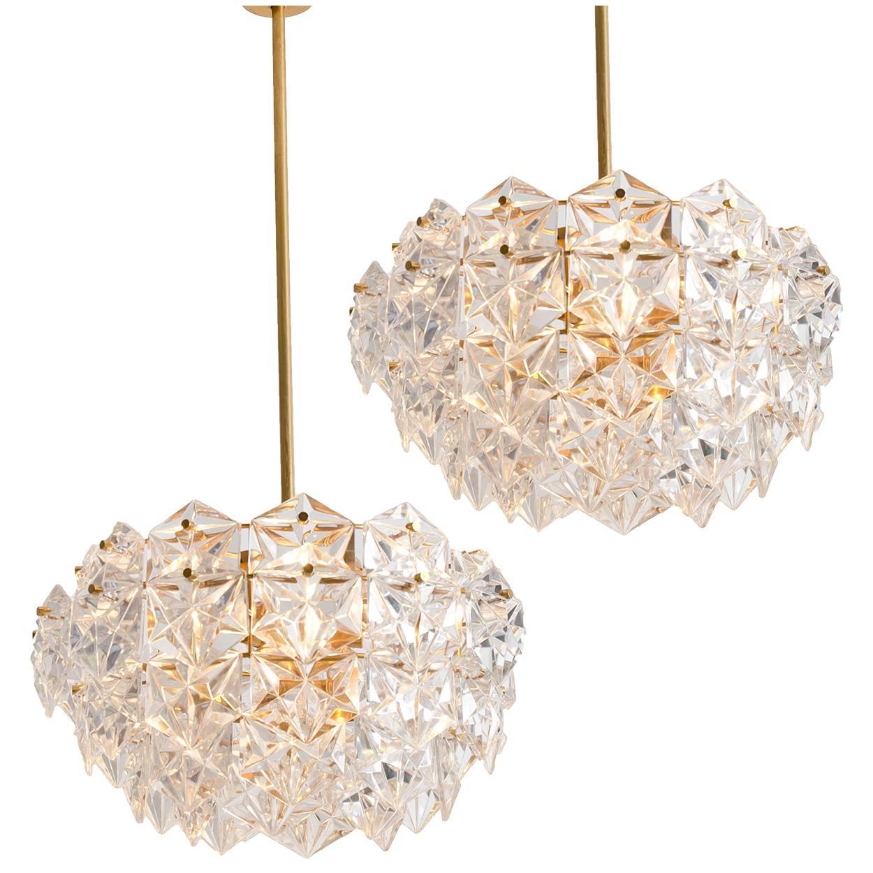 This set of modernist design light fixtures were designed by the Kinkeldey design team during the 1970s, and manufactured in Germany by Kinkeldey. Two chandeliers and two wall scones. The frame from the chandeliers is stamped with the Kinkeldey
