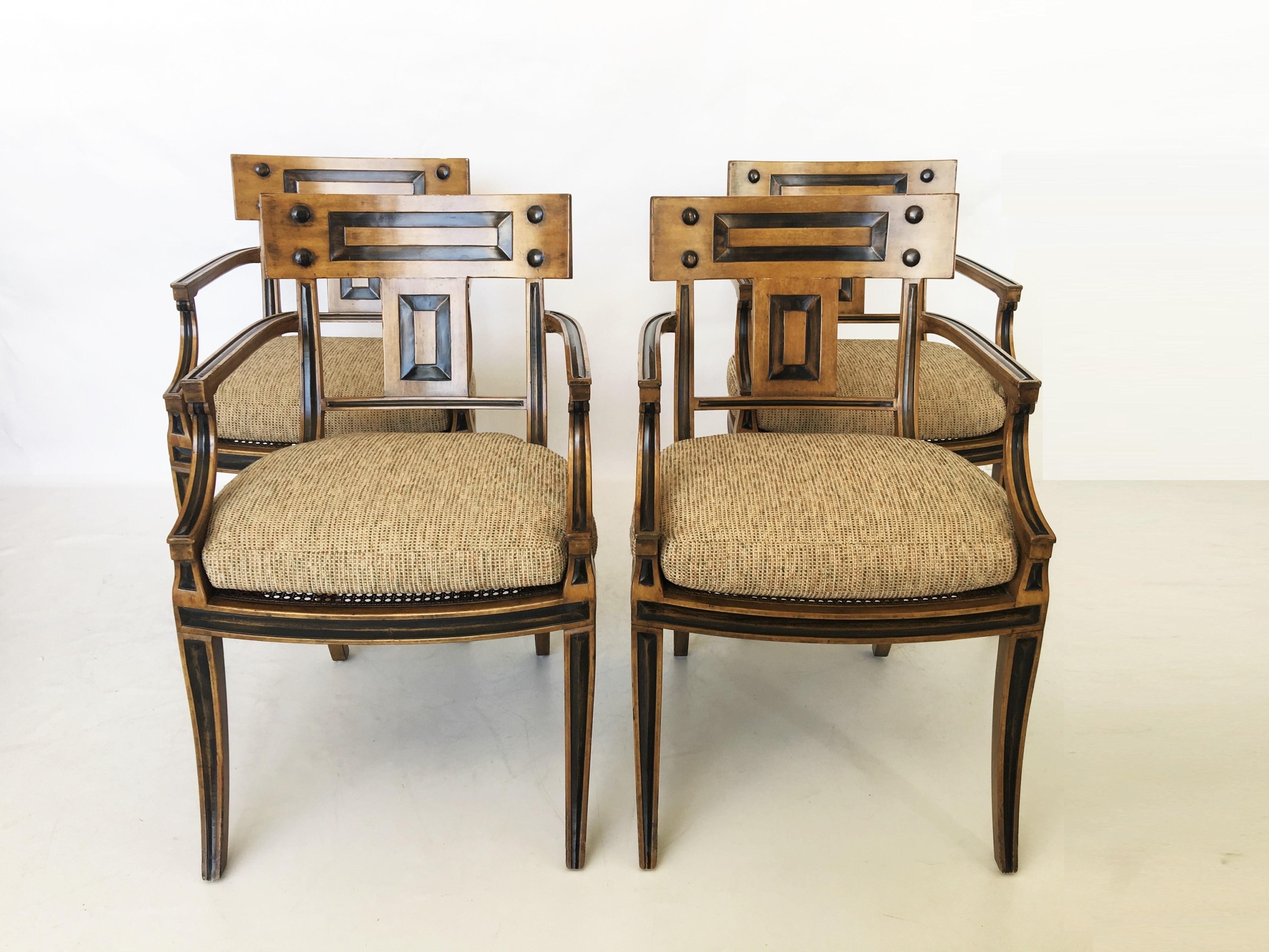 Beautifully crafted set of Klismos style dining chairs by Michael Taylor. They are finished in a warm tone, with ebony accents. The seat is caned, and the set comes with separate loose cushions.
Measures: Seat height without cushion: 15.5 in.