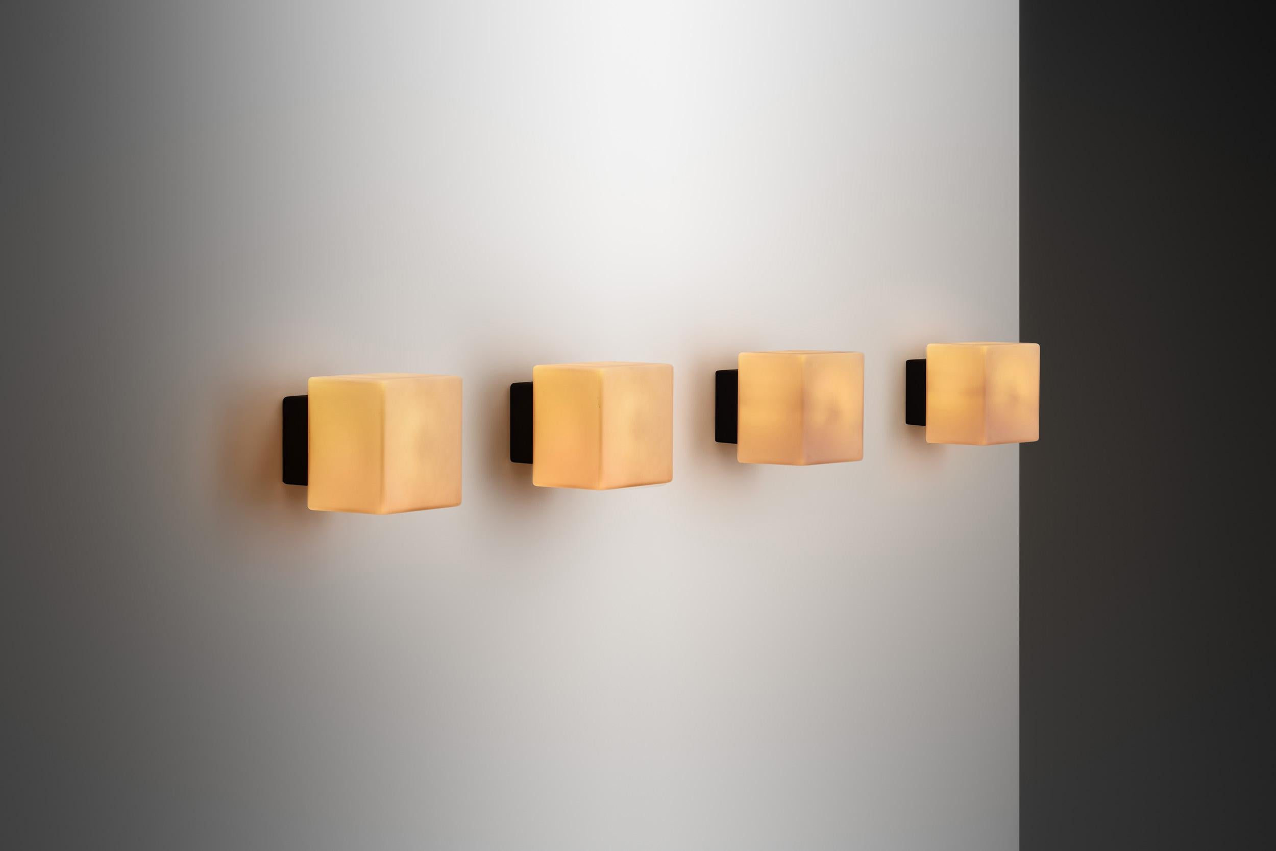 This set of Louis Poulsen 'Kubuarmatur' or cube lamp - more specifically known as the 'Model 38117' wall lamp - are a quintessential representation of Danish modern design, characterised by simplicity, functionality and a distinct minimalist