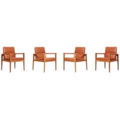 Set of Four Labeled Jens Risom Armchairs in Walnut in Cognac Leather