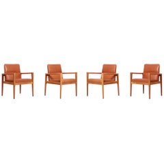 Set of Four Labeled Jens Risom Armchairs in Walnut in Cognac Leather