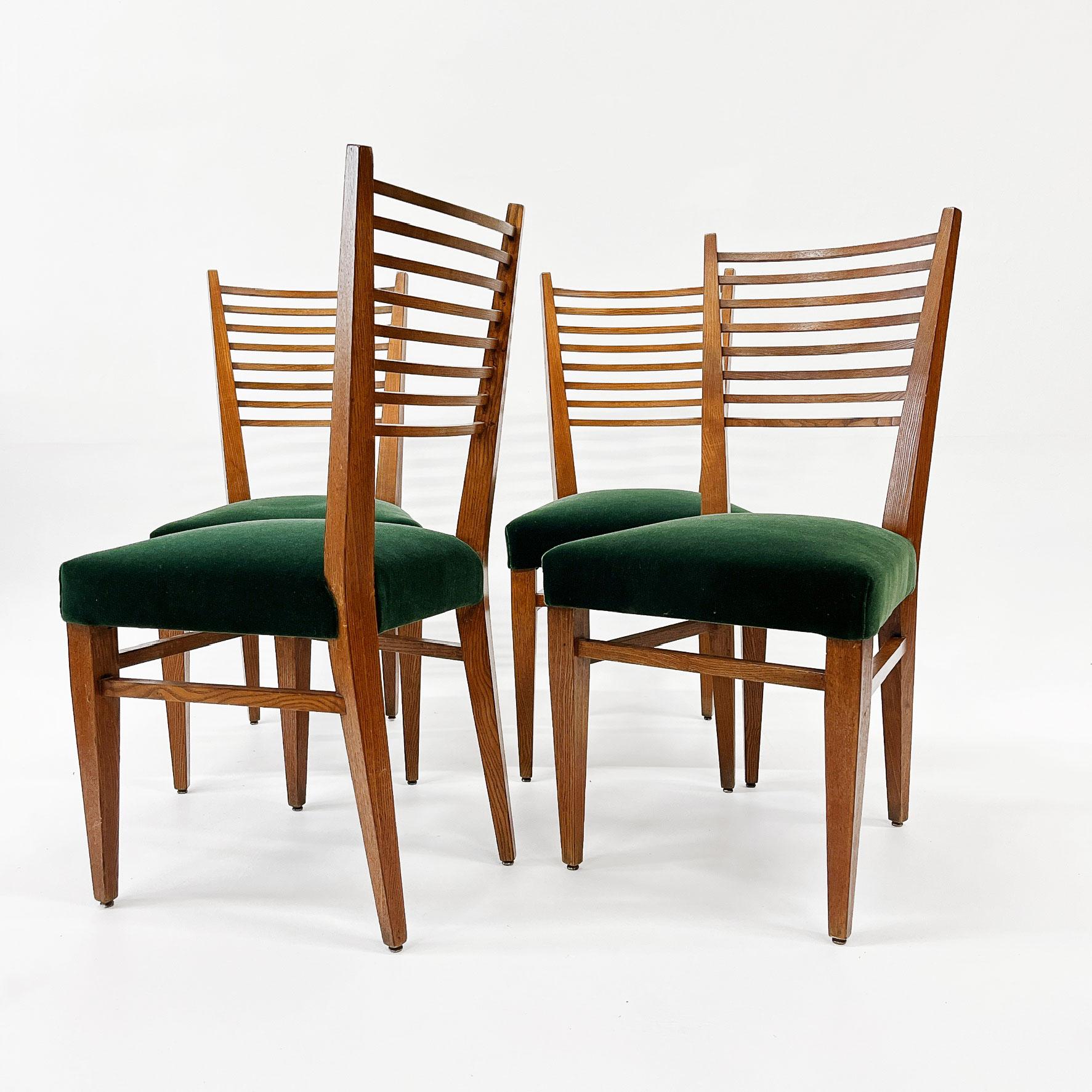 Set of four French ladder back oak chairs in the manner of Gio Ponti having reupholstered seat in a beautiful emerald green Mohair, circa 1950s.