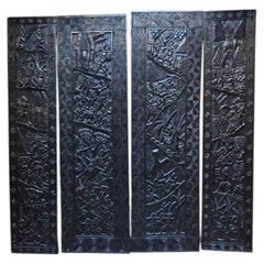 Set of Four Large African Carved Blackened Wood Narrative Panels