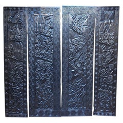 Set of Four Large African Carved Blackened Wood Narrative Panels