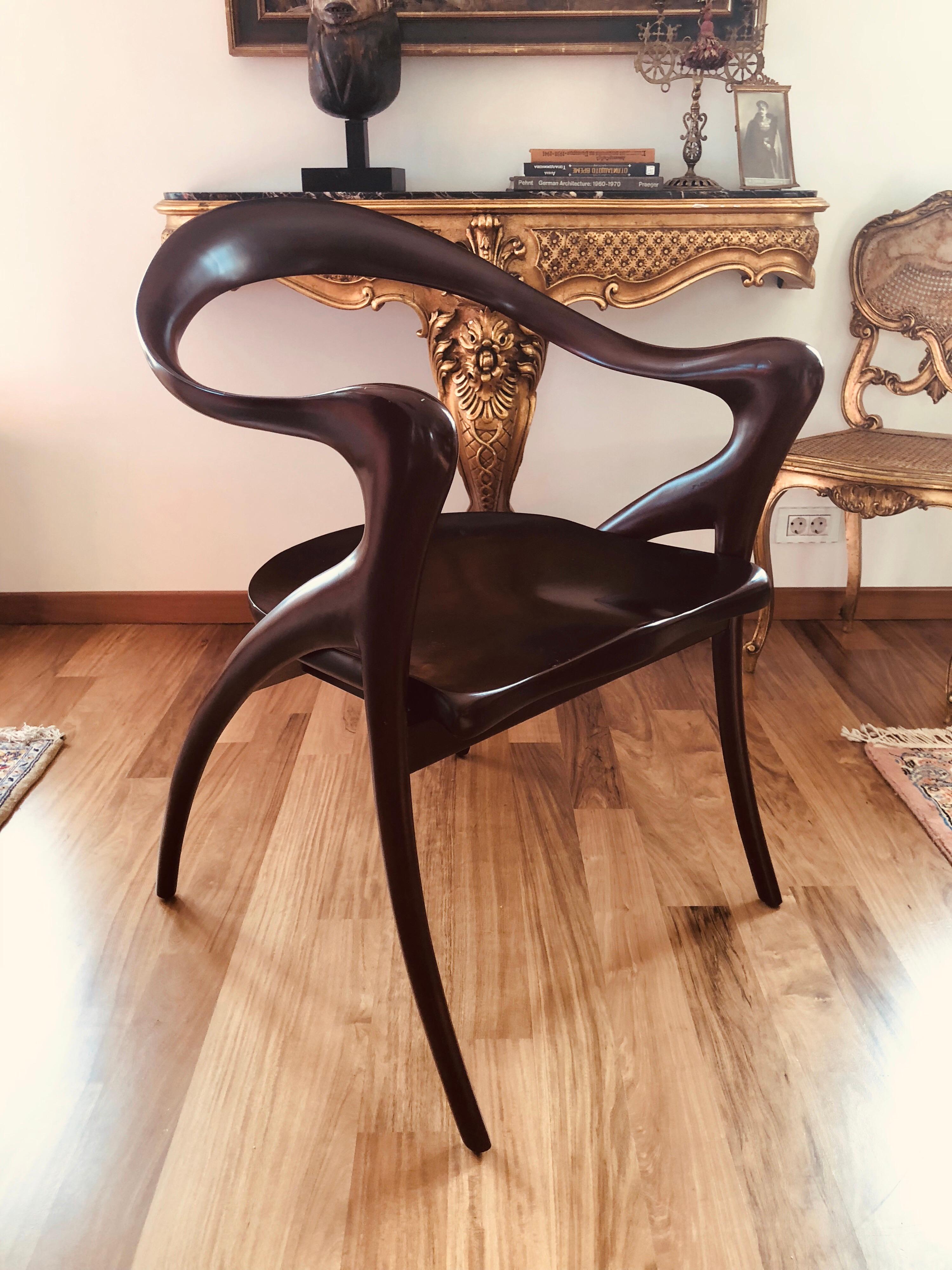 Paire de Grands fauteuils by Olivier de Schrijver (born in 1958) 
Model Ode à la femme with mahogany wavy headband extended by the armrests and the base, curved seats.