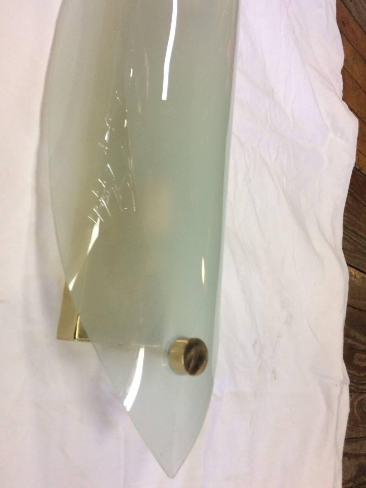 Brass Set of Four Large Glass Moderne Sconces. Sold per pair. For Sale