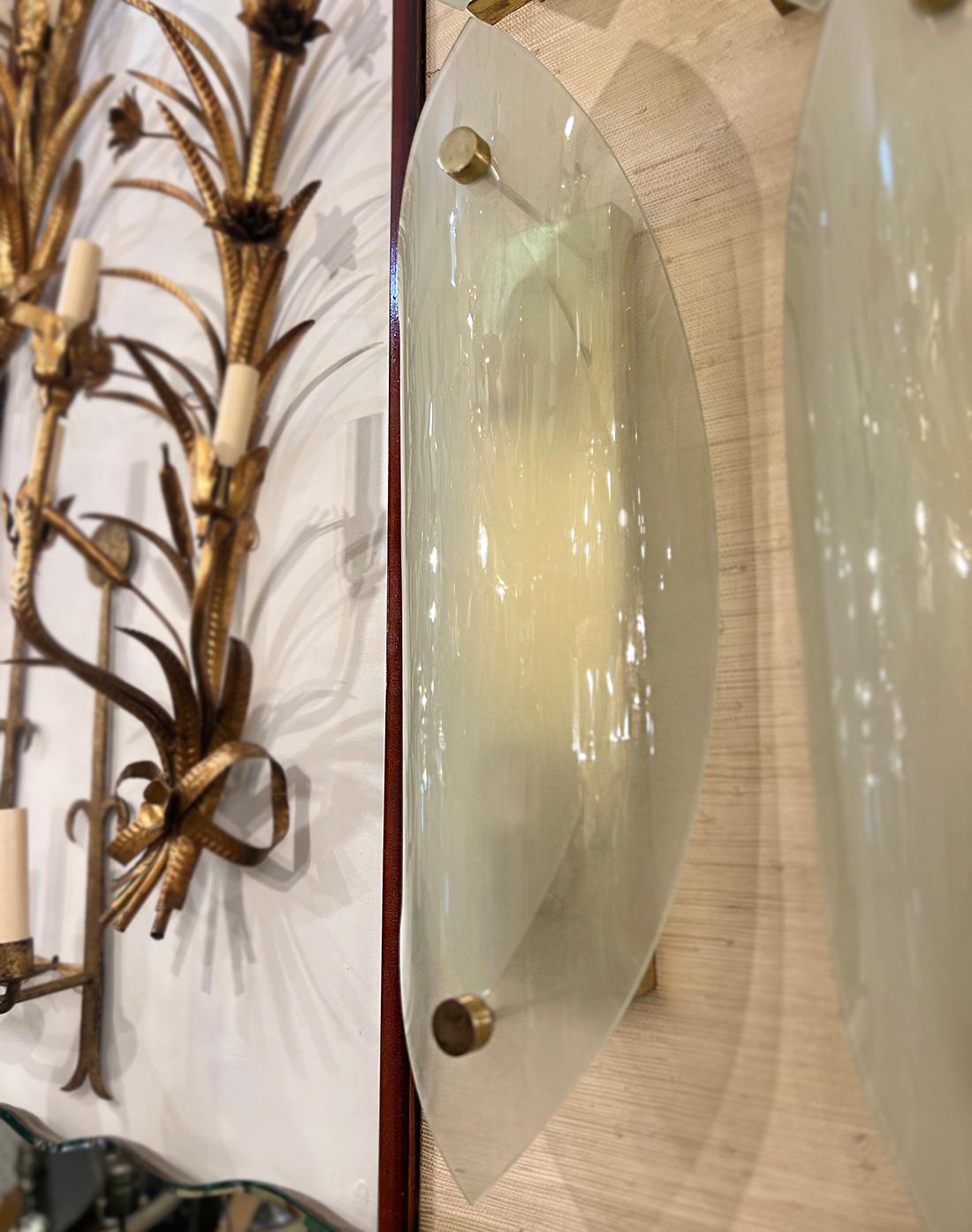 Set of four Italian sconces with frosted glass insets, body with gilt finish, circa 1960s. Two interior lights each. Sold per pair.
Measurements:
Height: 28