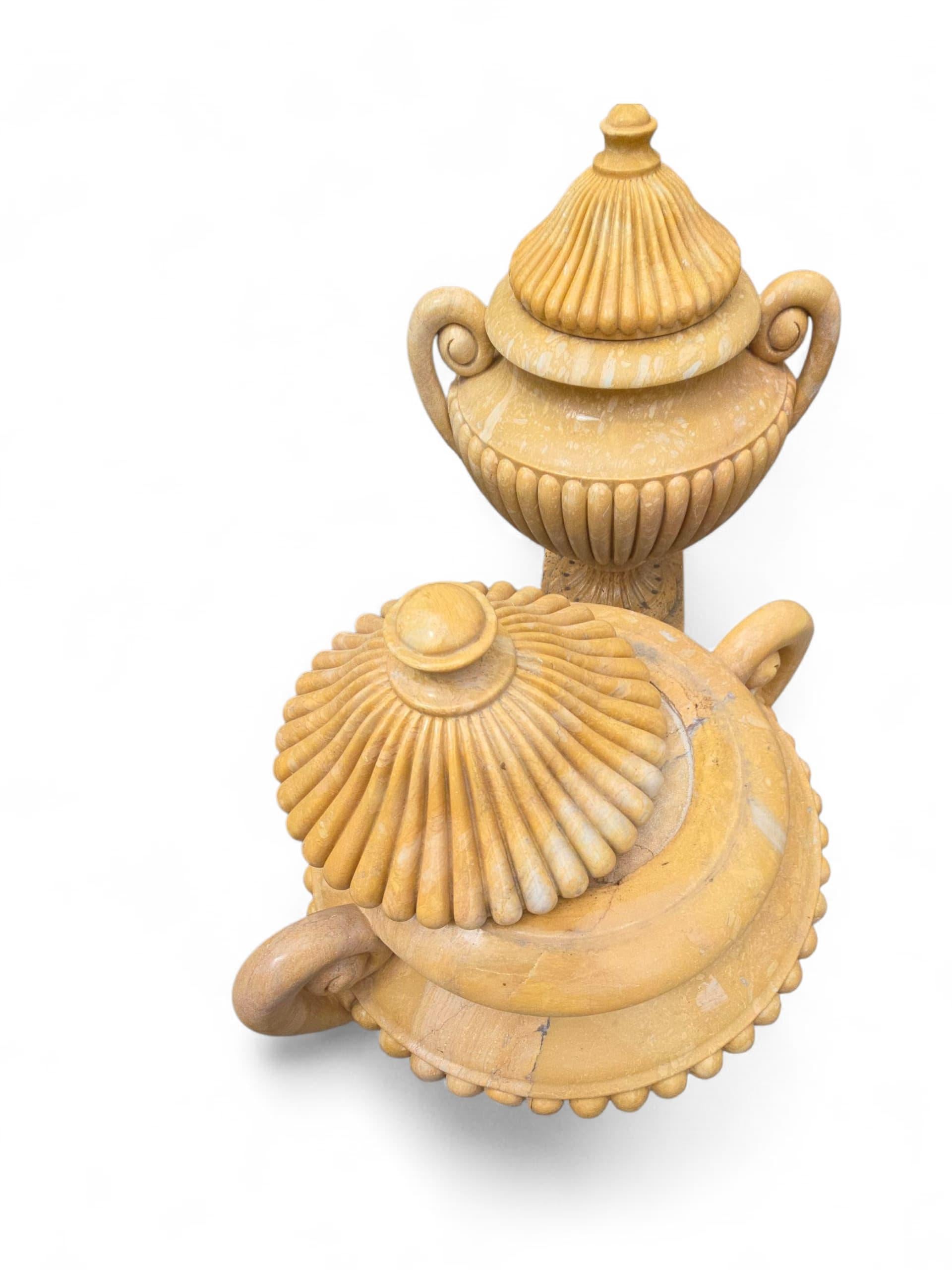 Elegant set of four large urns crafted from fine Italian marble, each featuring a turned body and matching lid. These classical vessels are expertly shaped with balanced proportions and smooth contours, showcasing the natural veining and tonal