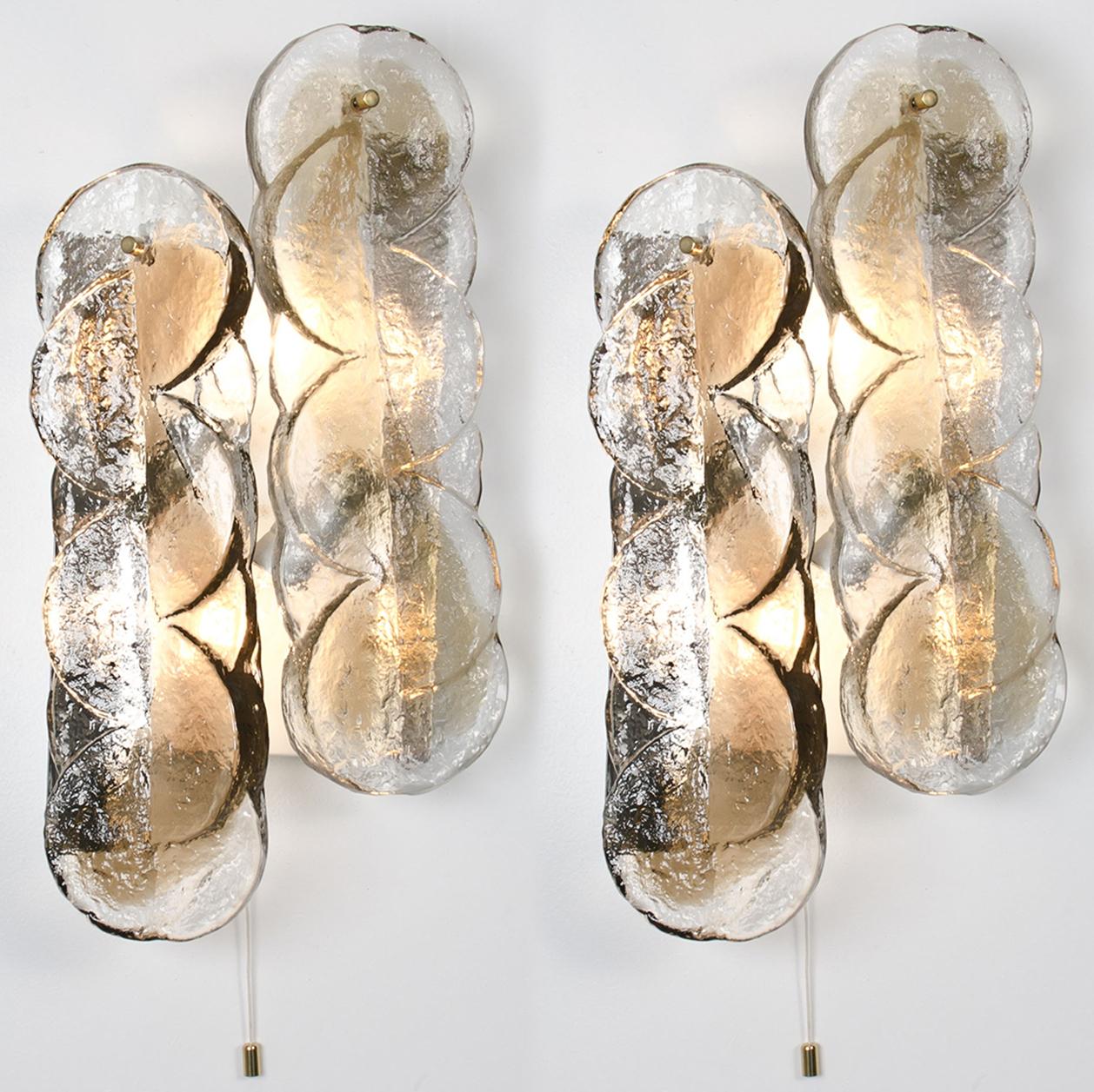 Set of high quality Murano glass light fixtures by Kalmar, 1960s. Clear twisted crystal glass panels with a light gold dish amber colored stripe in it. Illuminates beautifully.

Kalmar was the most important producer of premium-quality chandeliers