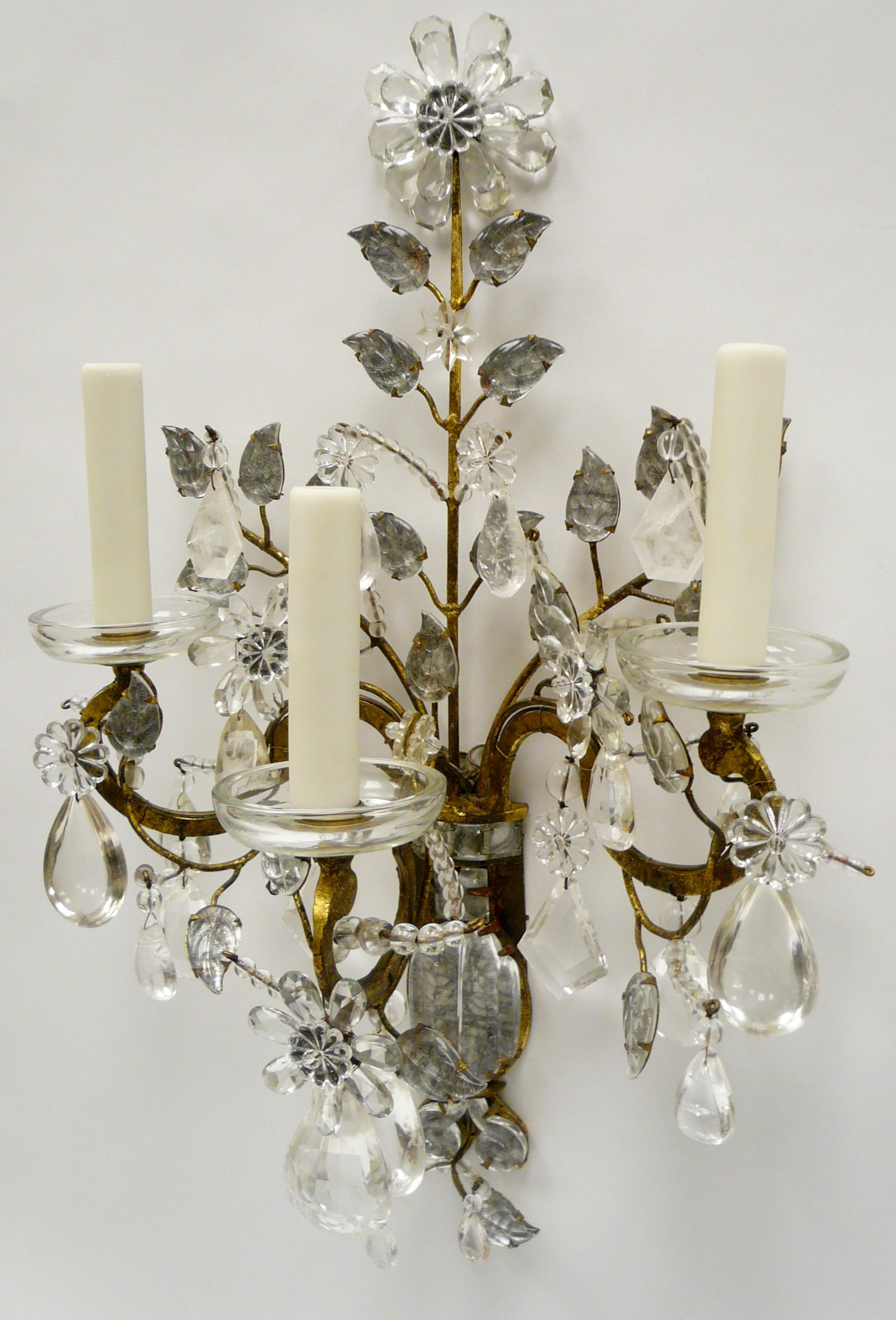 Faceted Set of Four Large Maison Baguès Rock Crystal and Gilt Iron Sconces