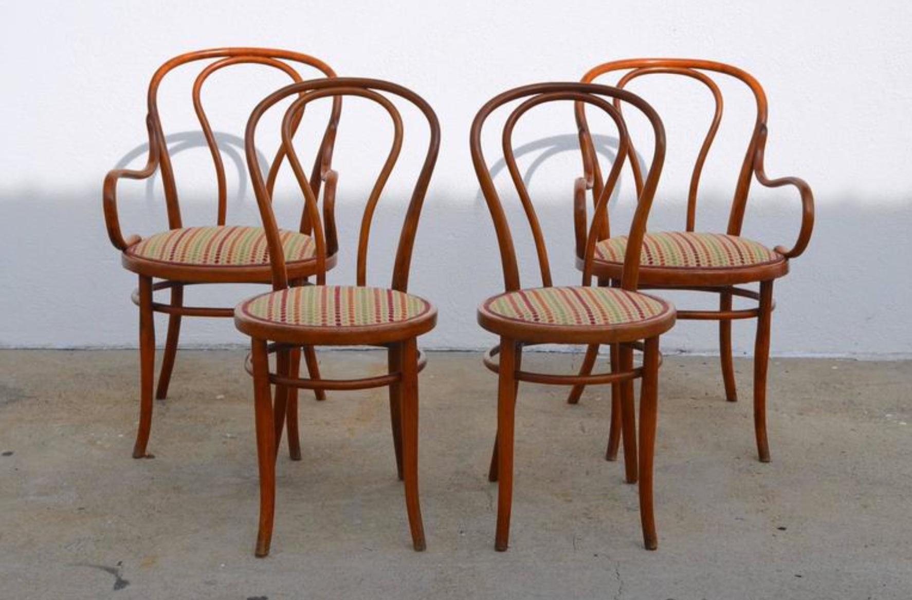 Set of four large slender bentwood dining set by Thonet. Early 20th century European production. Seat fabric can be changed with C. O. M. (one yard) at no extra charge.

Dimensions:

Armchair: 36 in. tall / 19 in. seat height, 23 in. wide, 27.5