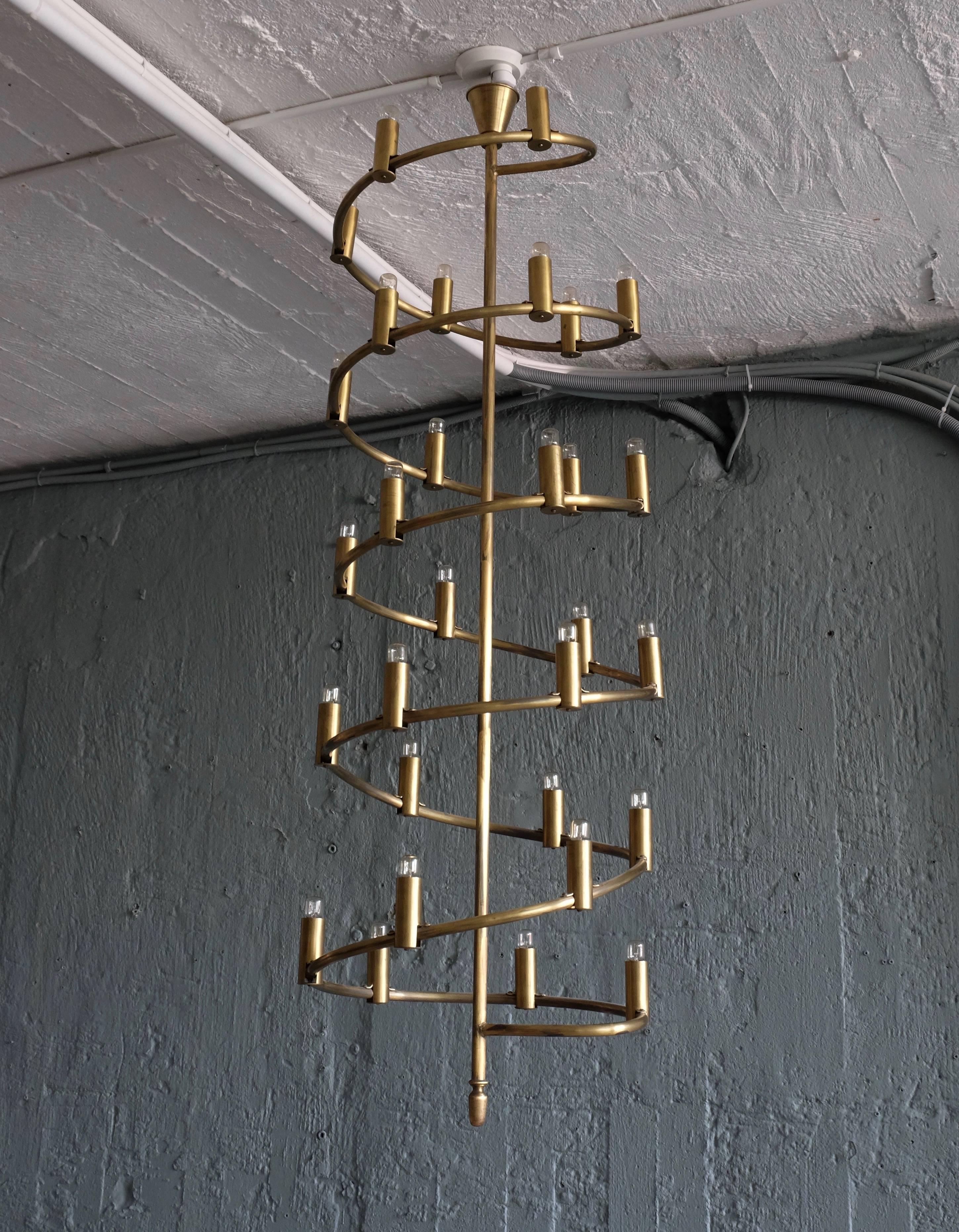 Unique chandeliers, special made for a villa in Sweden 1965. Set of 2 available.
Solid brass. Original extensions included. Very high quality, producer and designer unknown.
Height: 150 cm (extension 150 cm), total with extentions: 300 cm. 
Please