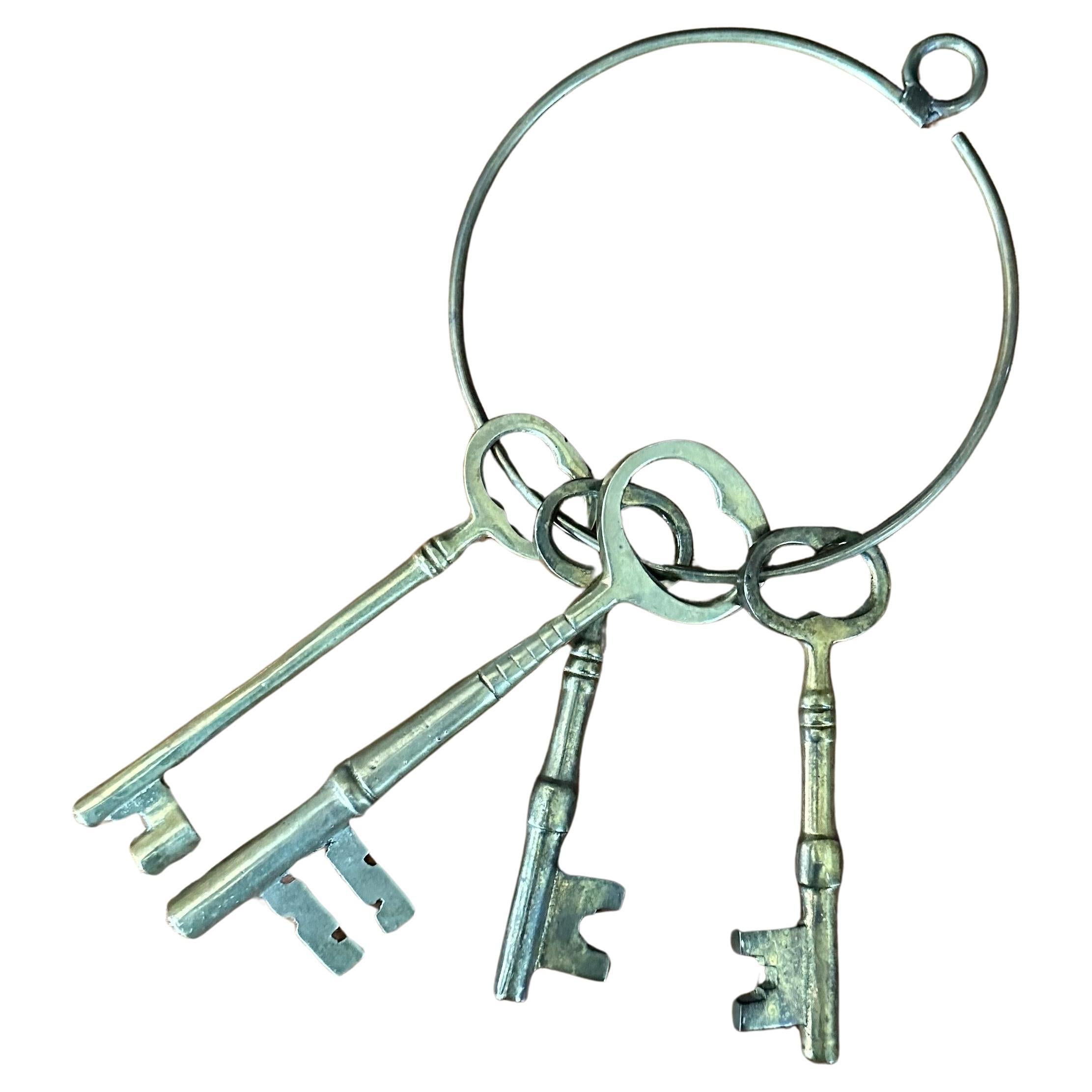 Set of Four Large Vintage Skeleton Keys on a Ring For Sale