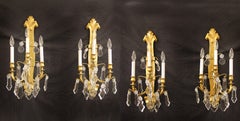 Set of Four Late 19th / Early 20th Century Gilt Bronze and Crystal Sconces