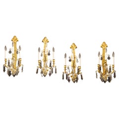 Set di quattro lampade in bronzo dorato e cristallo della fine del XIX secolo/inizio del XX secolo