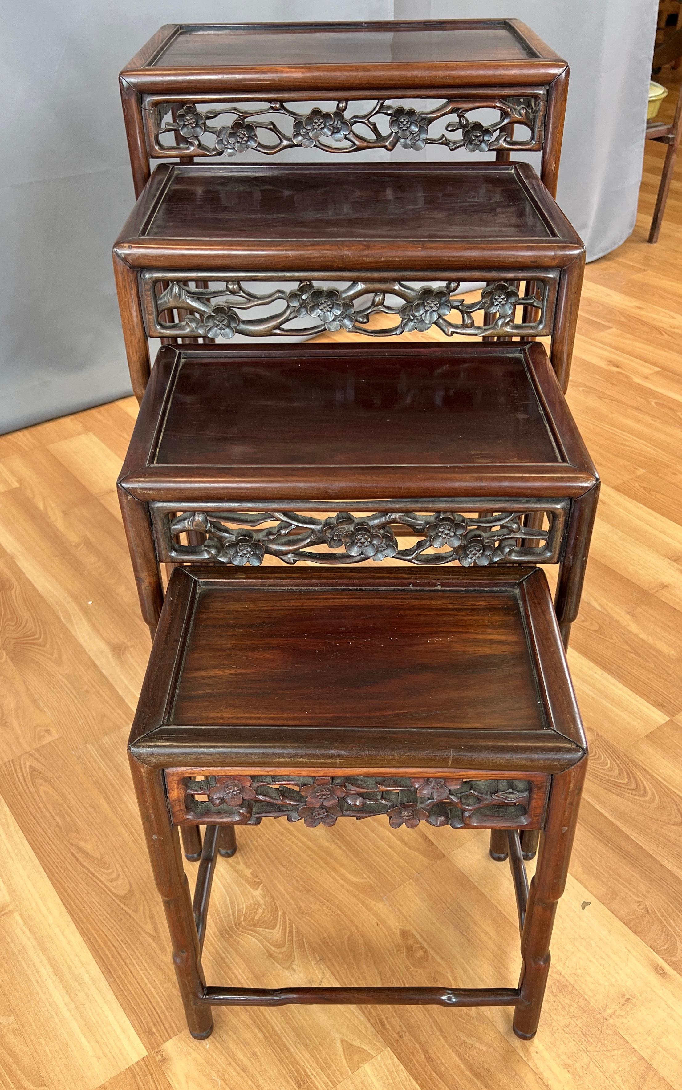 Carved Set of Four Late 19th or Early 20th Century Chinese Nesting Tables of Zitan Wood For Sale