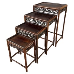 Antique Set of Four Late 19th or Early 20th Century Chinese Nesting Tables of Zitan Wood