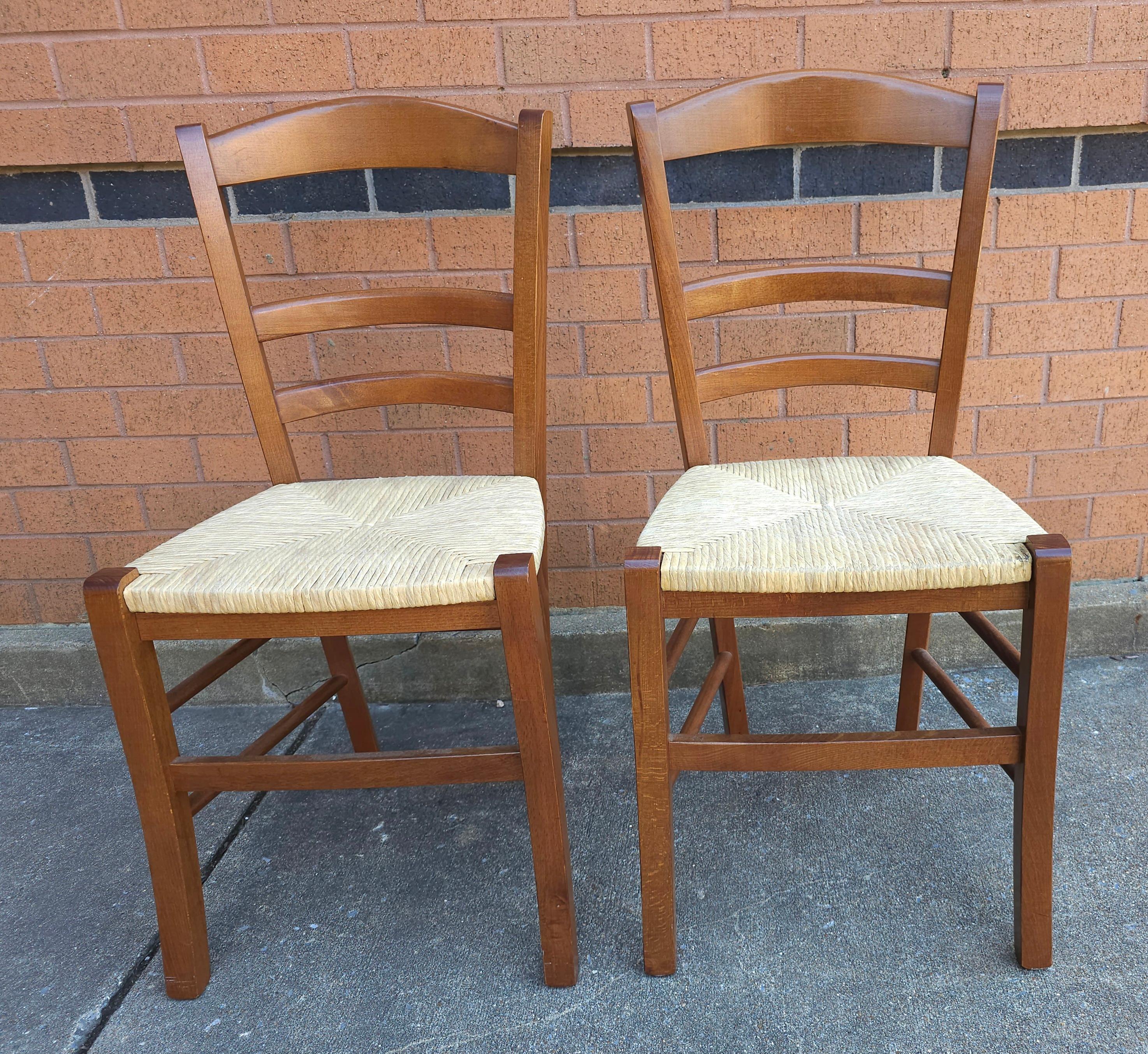 A Set of Four Late 20th Century Italian Country stained Cherry and Rush Seat and ladder back Dining Chairs. Measures 17