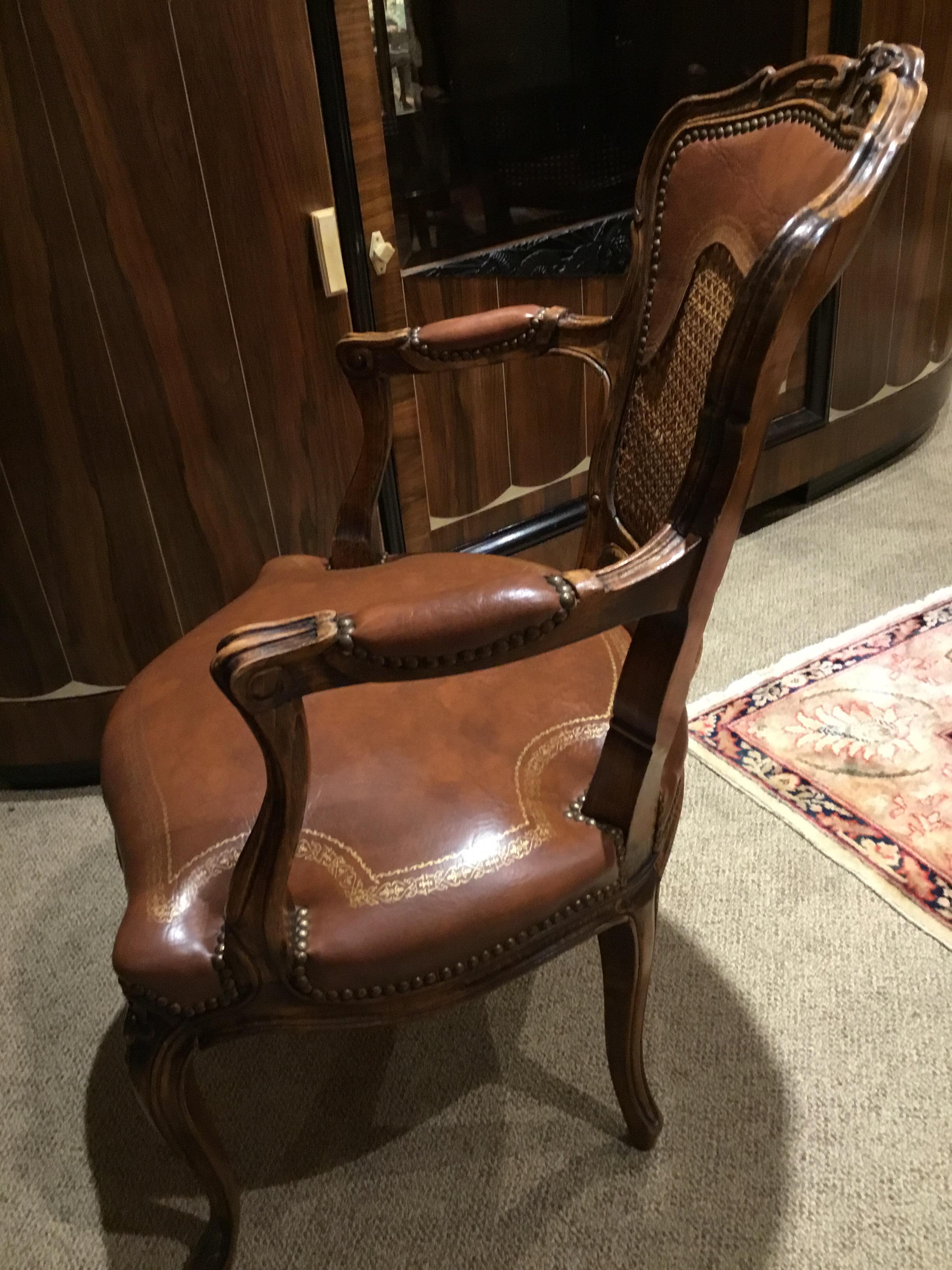 Excellent set of four chairs upholstered in leather with a cane back.
All very comfortable with good seat cushion and a curved back.
Carving at the center crest of the chairs with a floral and foliate
Motif and repeated at the center front seat