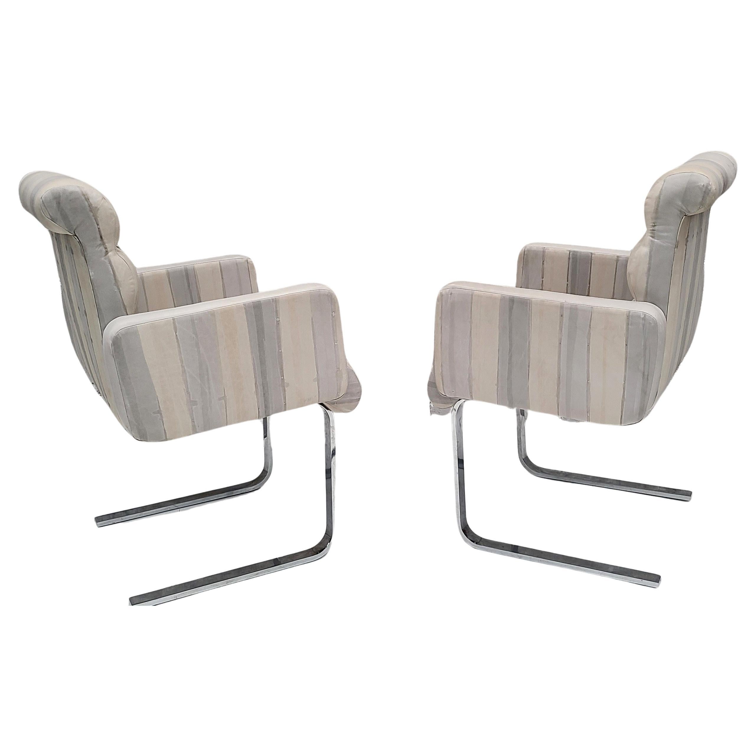 Please reach out for efficient shipping to your location.

Set of 4 striped leather and chrome dining armchairs by Preview.
