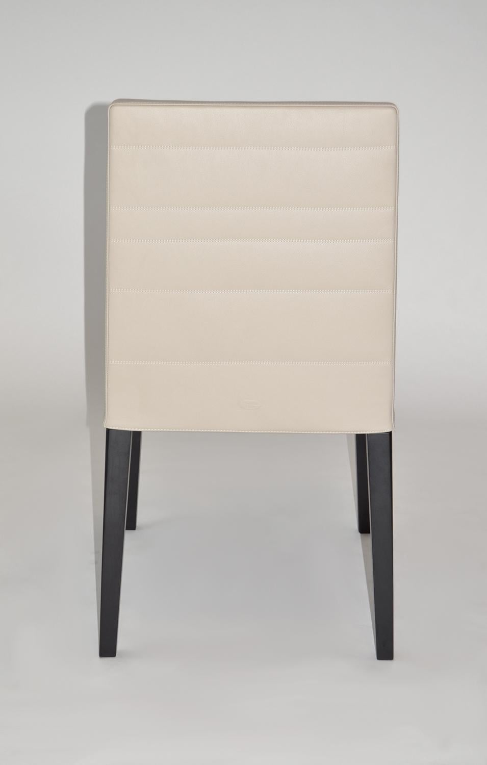 Italian Set of Four Leather and Wood Dining Chairs by Poltrona Frau. 'Louise' 