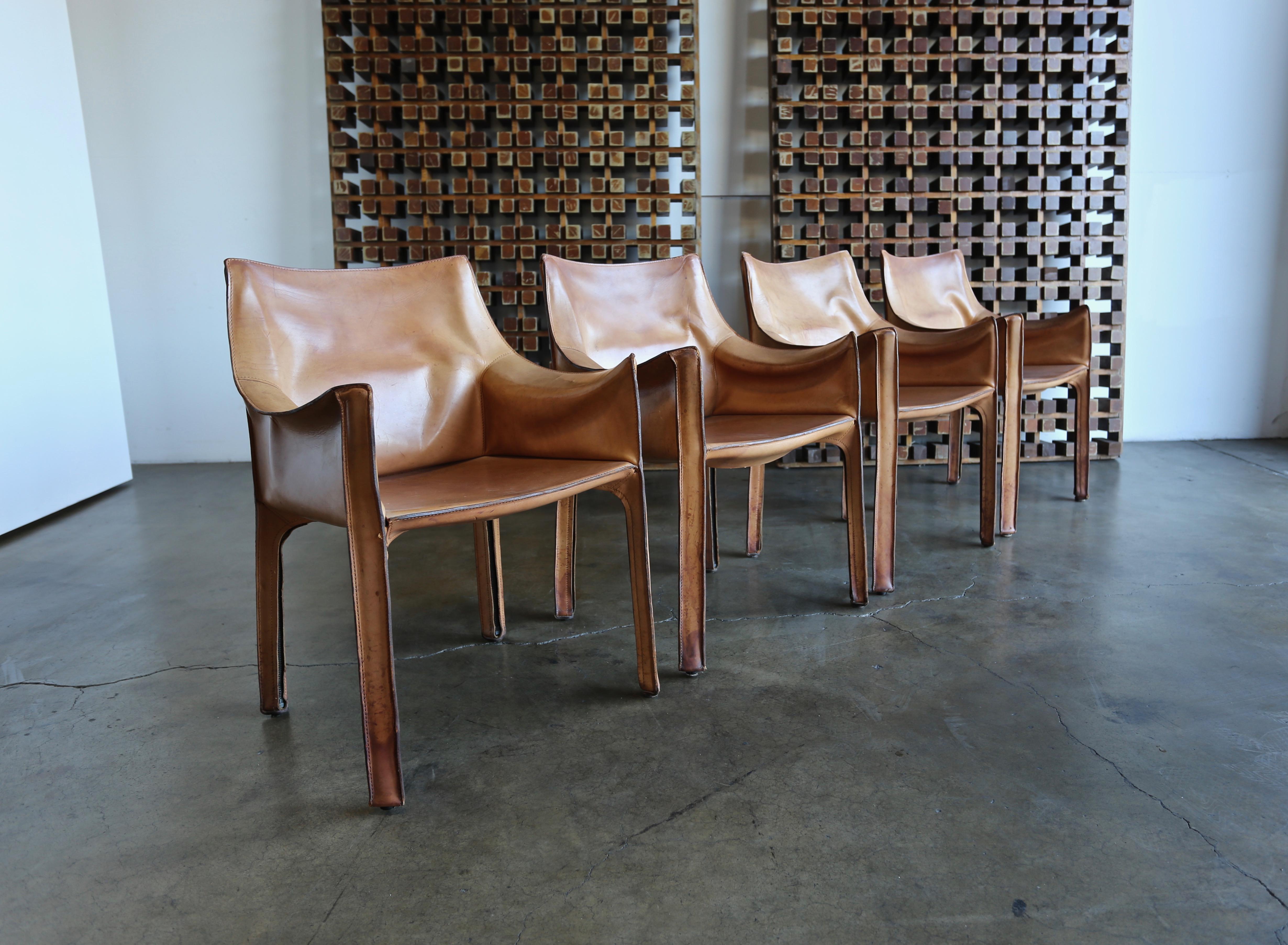 Set of four leather Cab armchairs by Mario Bellini for Cassina, circa 1980. This set has a beautiful original patina.