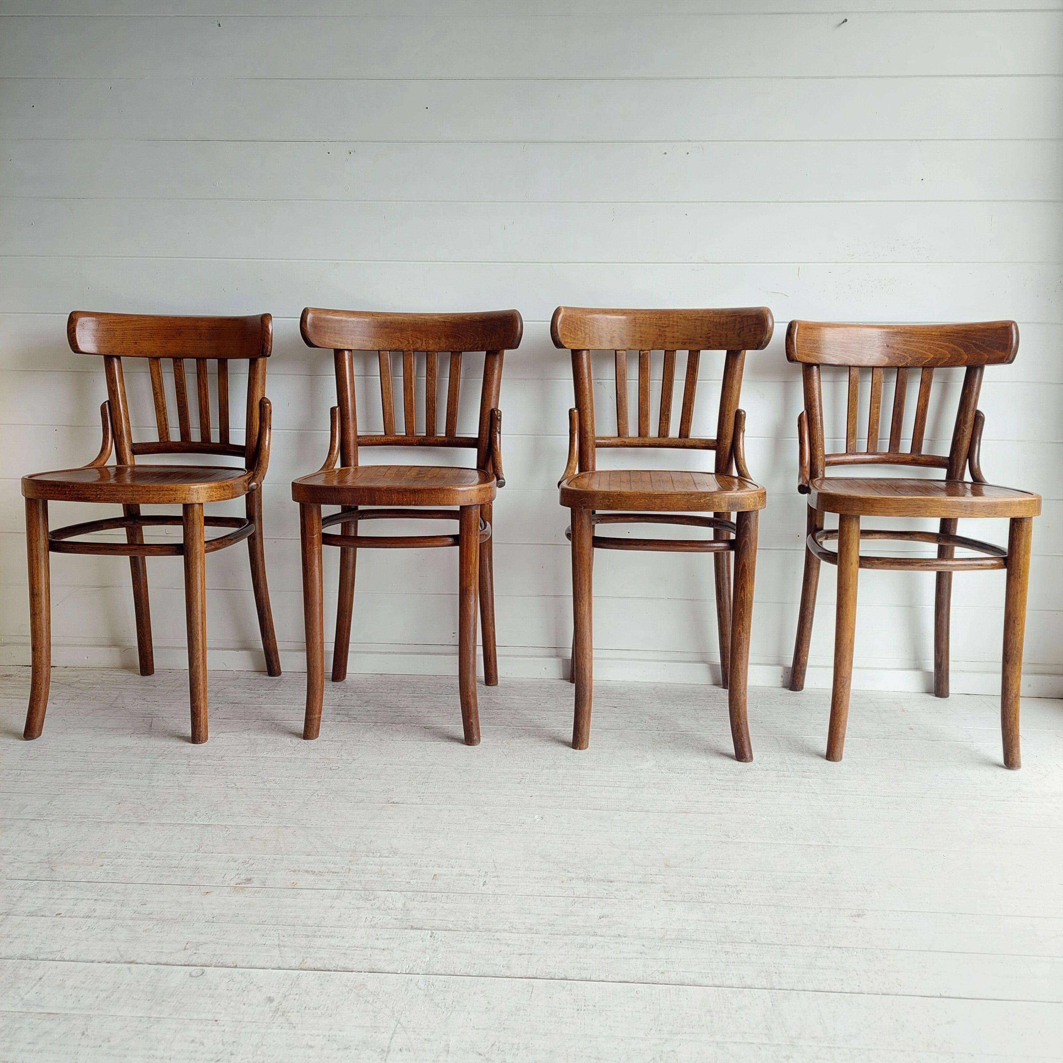 4 Chairs designed by Thonet, for Ligna, Czechoslovakia, circa 30s.
The Ligna brand, was one of several Thonet factories.

The structure is made of bent beechwood.
2 of them carry its makers' mark and country of provenance under the seats (see