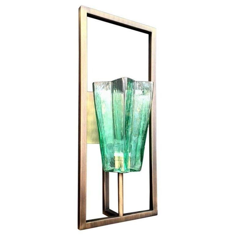 Set of Four Limited edition emerald green sconces in textured Murano glass with star-shaped tall shades mounted on rectangular brushed bronze structures / Made in Italy.
*Option to Split into Pairs is Available.
Dimensions:
28