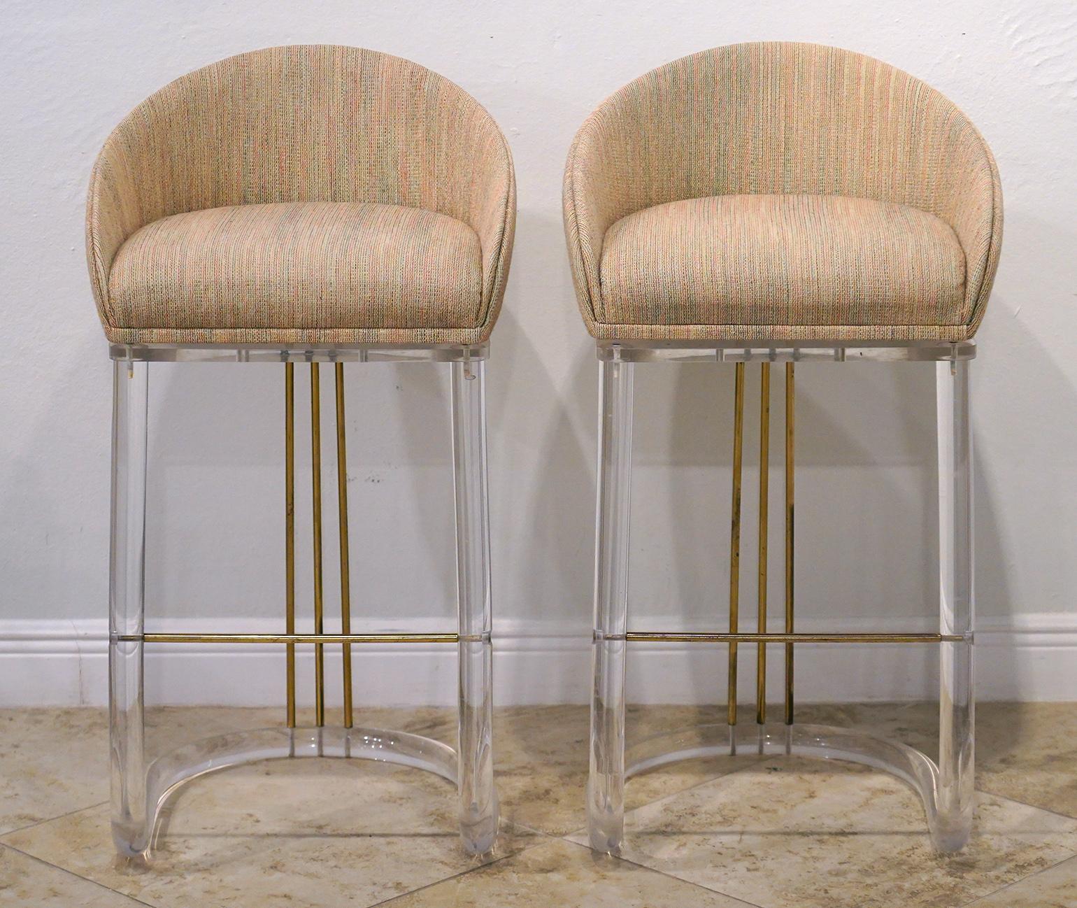 American Set of Four Lion in Frost Upholstered Lucite and Brass Swivel Bar Stools, Signed