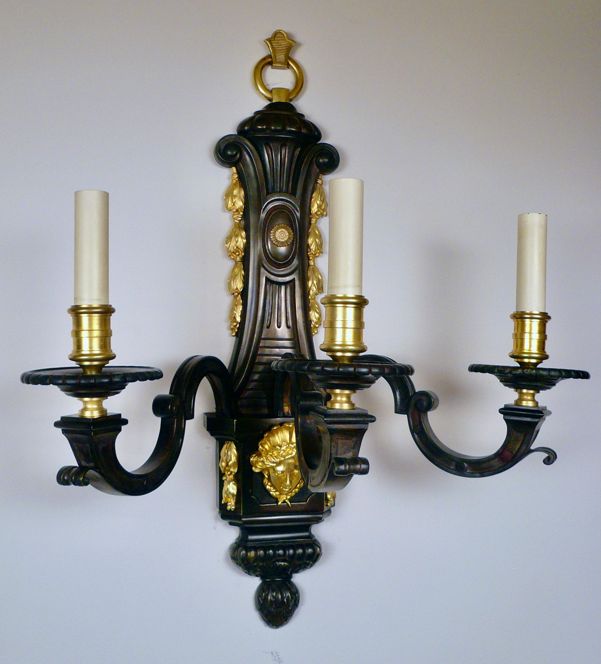 This large and impressive set of four Louis XIV Style bronze sconces are of the finest quality. They feature many Baroque era motifs including foliate swags, acanthus leaves, and Classical busts.
They have been newly re-wired and are ready for use.