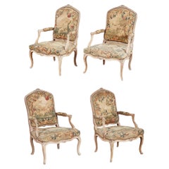 Ensemble de quatre fauteuils rococo Louis XV en broderie d'origine
