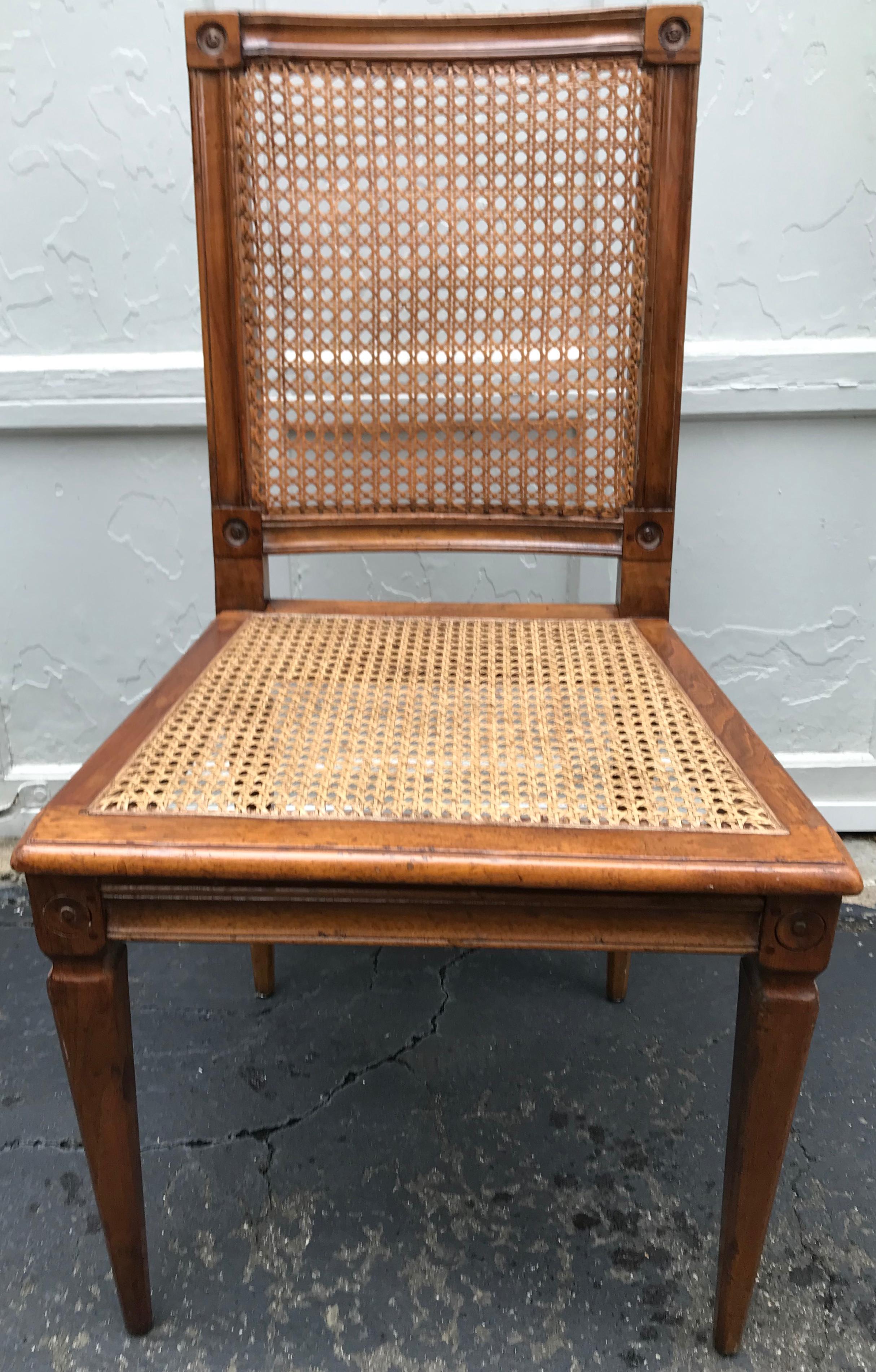 Set of Four Louis XVI Caned Chairs. Handsome set of blonde wood carved chairs in the Louis XVI style from the 1920’s with wood peg and corner block detailing with tapered legs supporting newly caned seats below gracefully curved backs with original