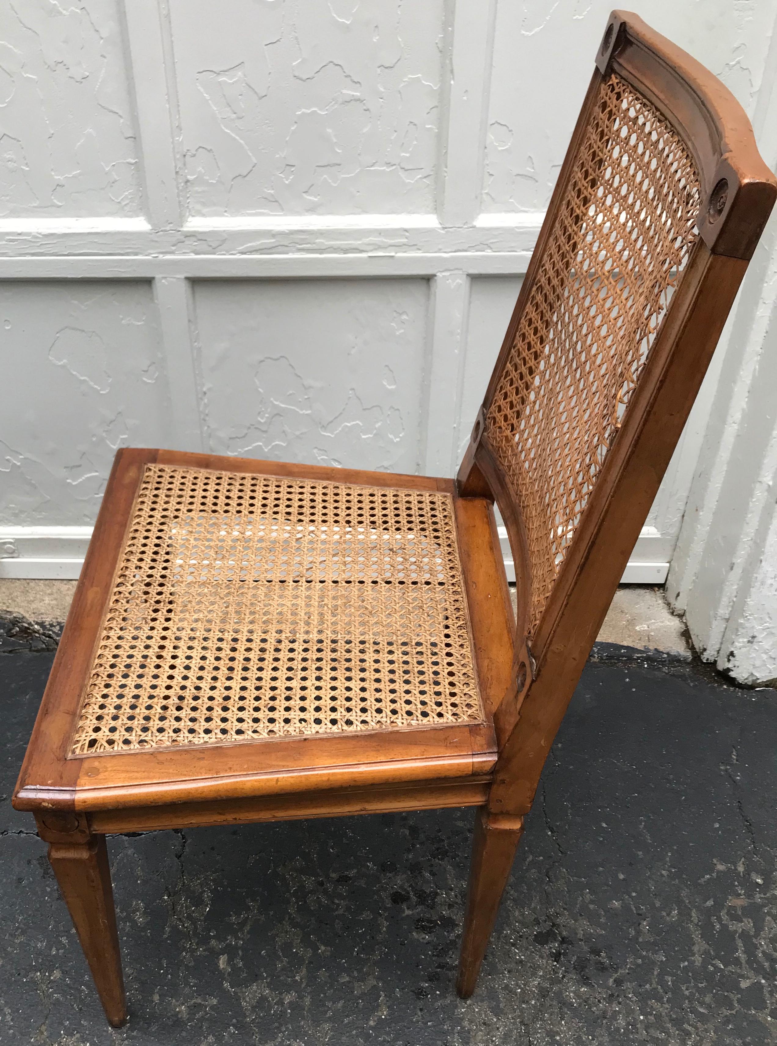 Carved Set of Four Louis XVI Caned Chairs For Sale