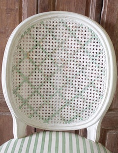 Set of Four Louis XVI Style French Painted Cane Back Dining Chairs