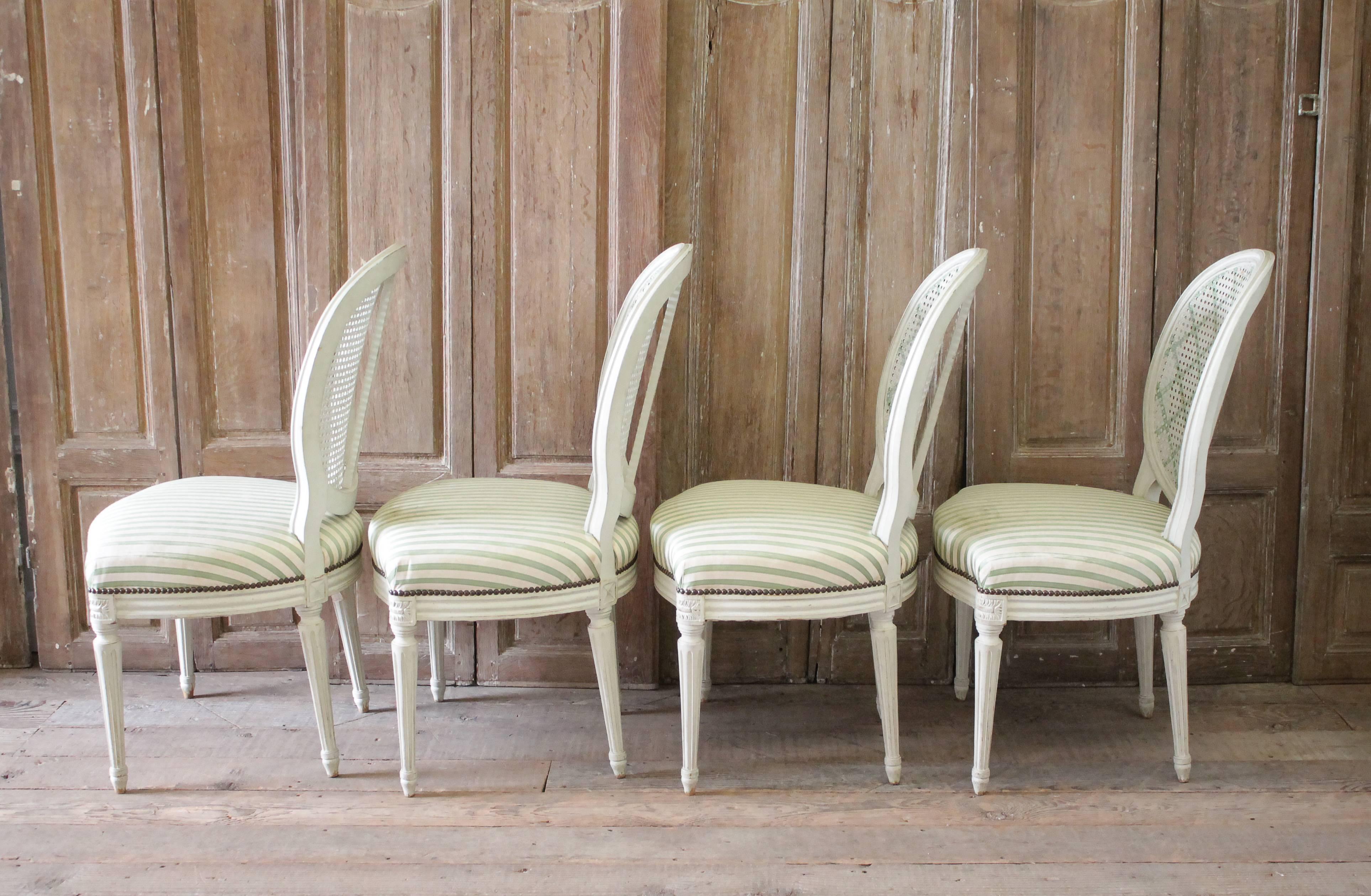 Upholstery Set of Four Louis XVI Style French Painted Cane Back Dining Chairs