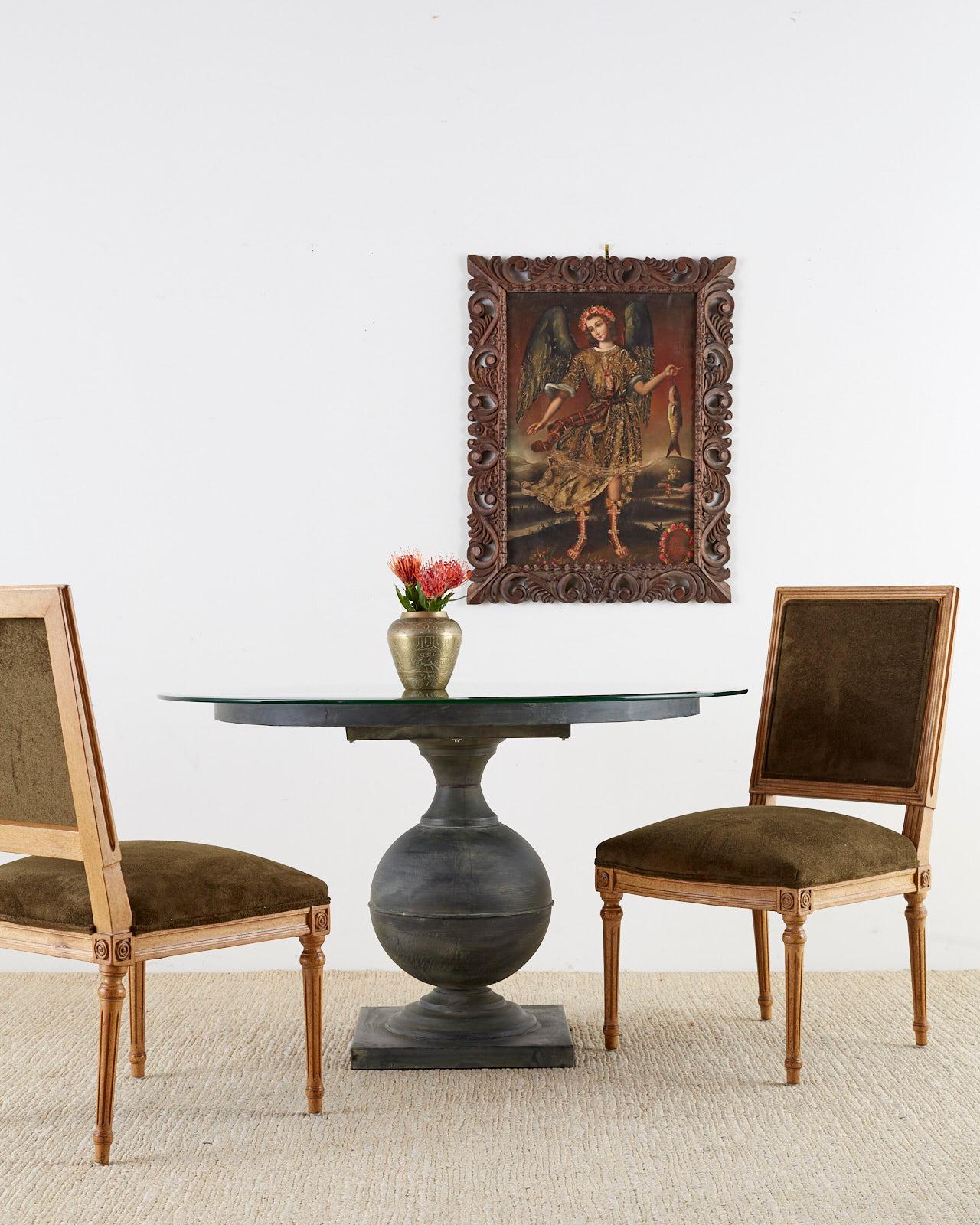 Elegant set of four French Louis XVI style dining chairs featuring new dark green velvet upholstery. The frames have a Classic square back and seat supported by tapered and fluted legs. The corners are decorated with a modern round design instead of
