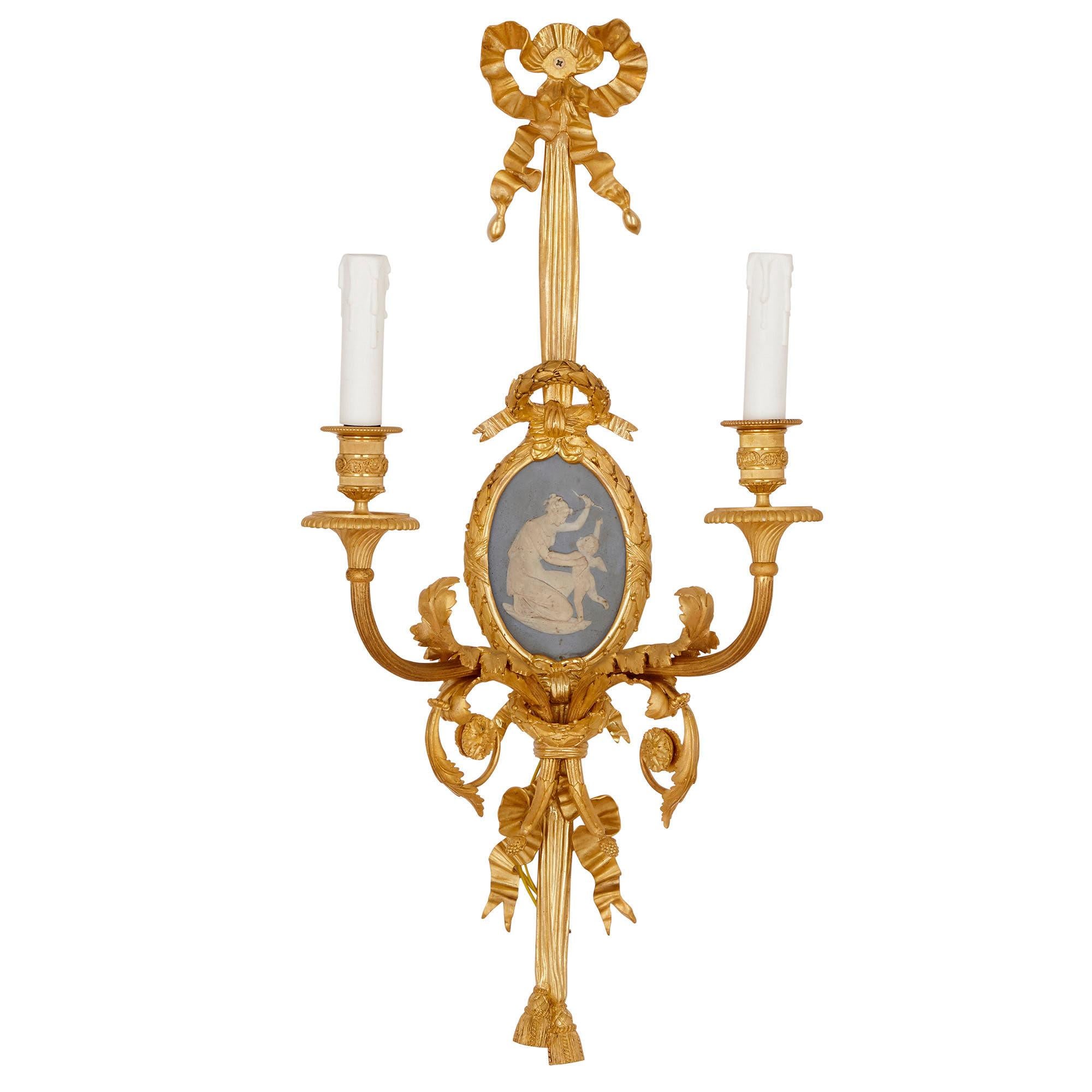These exquisite wall lights were created in the late 19th century by the famous bronzier, Henri Vian (French, 1860-1905). These wall lights are stamped ‘HV 955’ for Henri Vian, along with ‘BY’ for the prestigious Beurdeley furniture-making workshop