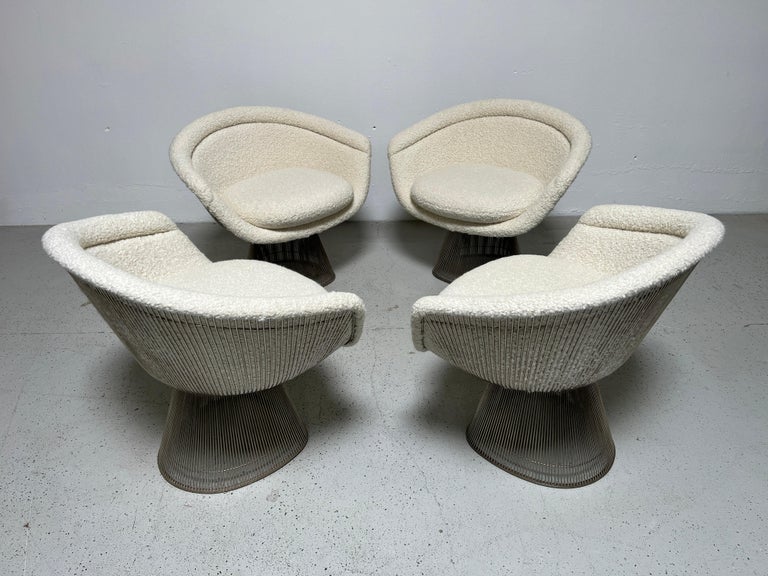 A set of four lounge chairs designed by Warren Platner for Knoll. Nickel plated steel newly upholstered in Holly Hunt / Teddy / Winter White. We are willing to split the set.