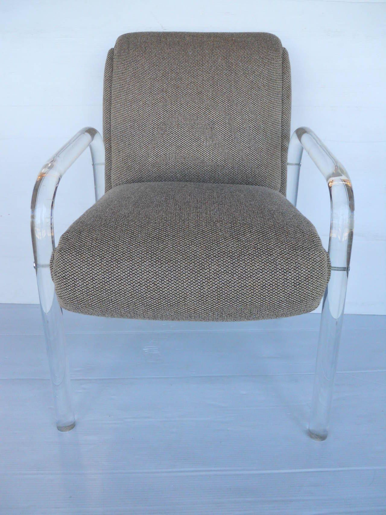Set of four Lucite dining chairs by Lion in Frost Lucite and woven fabric. Seat depth 19