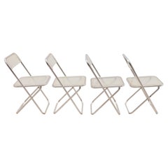 Ensemble de quatre chaises Plia en Lucite dans le style des chaises de Giancarlo Piretti, vers les années 1970