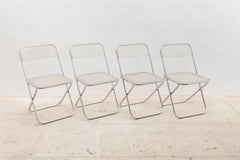 Ensemble de quatre chaises Plia en Lucite dans le style des chaises de Giancarlo Piretti, vers les années 1970